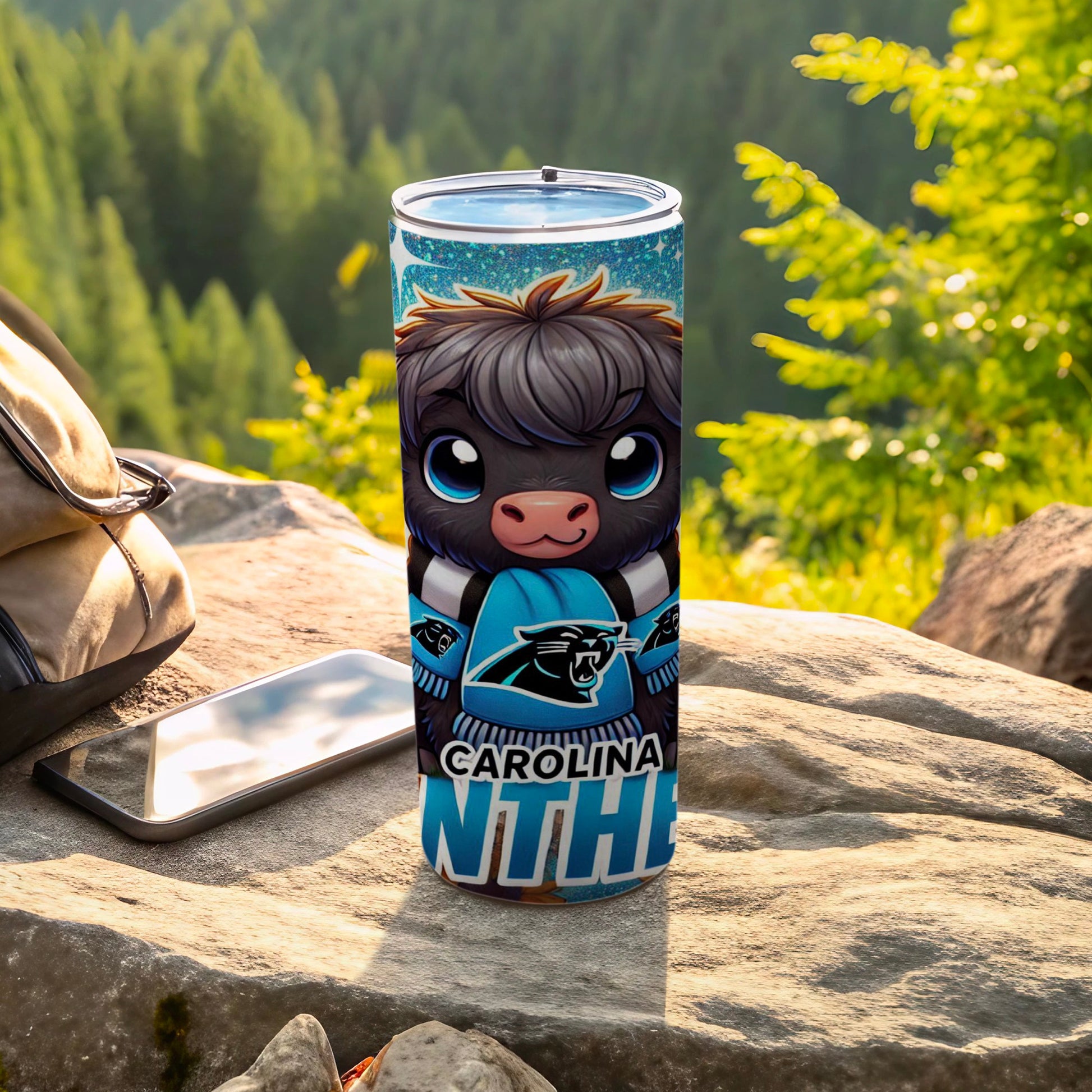 Carolina Panthers themed tumbler with a cartoon highland cow mascot.