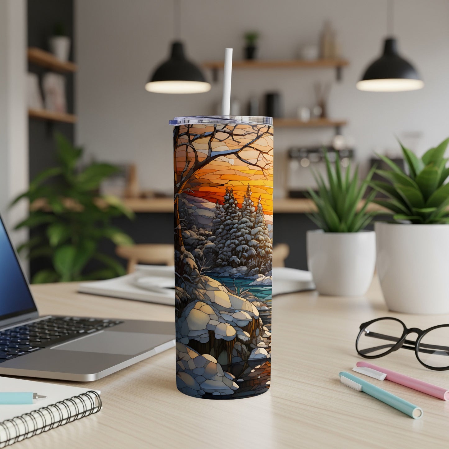 Winter forest scene with sunset and snow on a tumbler.
