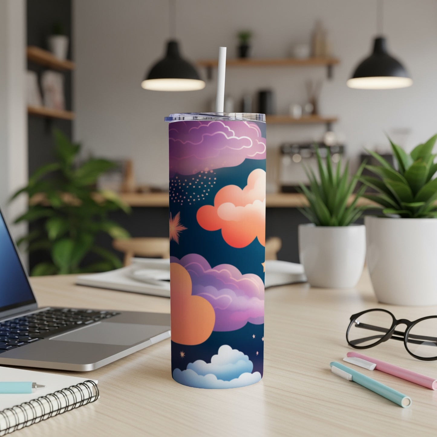 Tall tumbler with a colorful cloud and star pattern, includes straw.