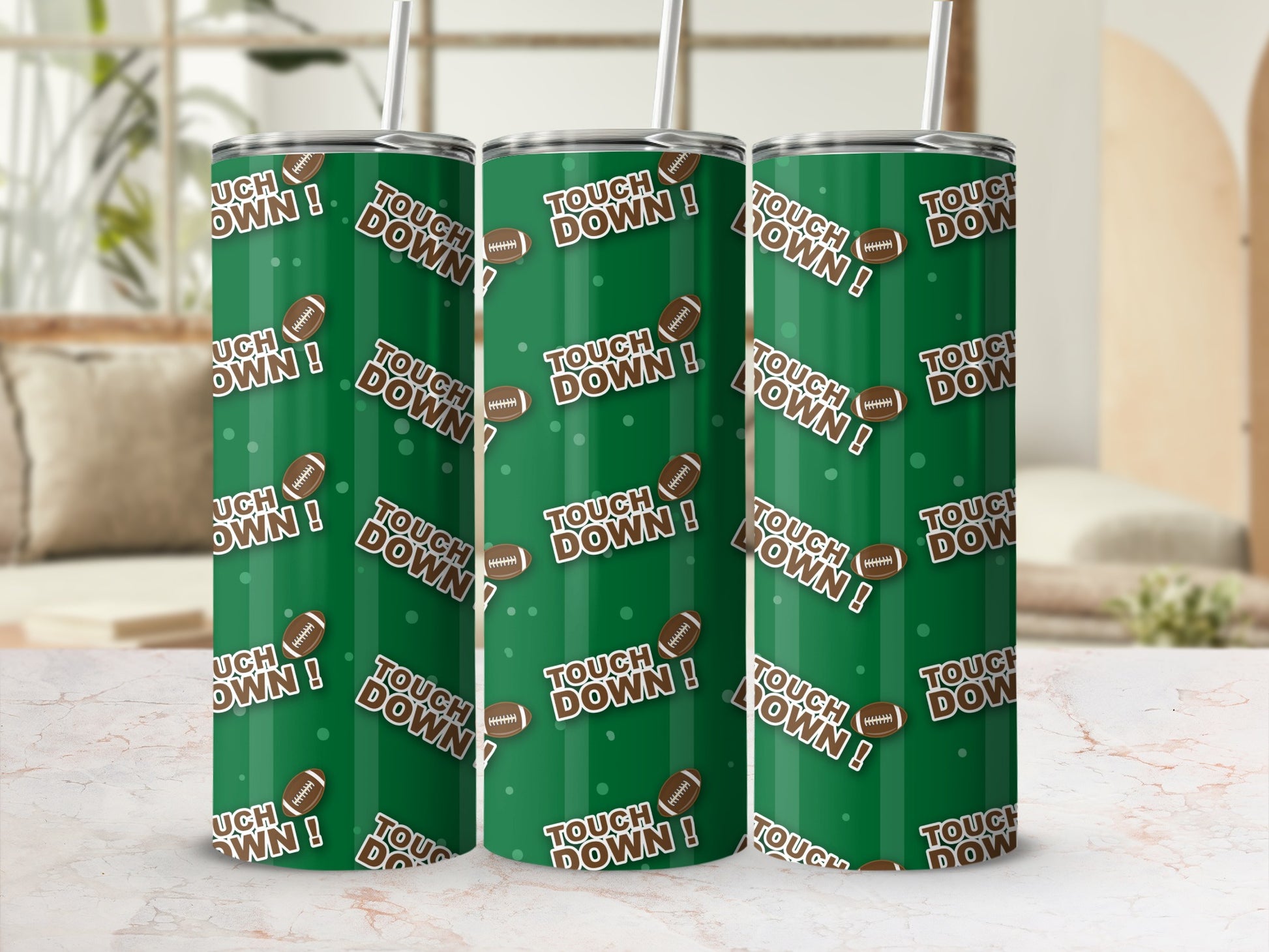 Three green tumblers with a repeating football and text pattern.