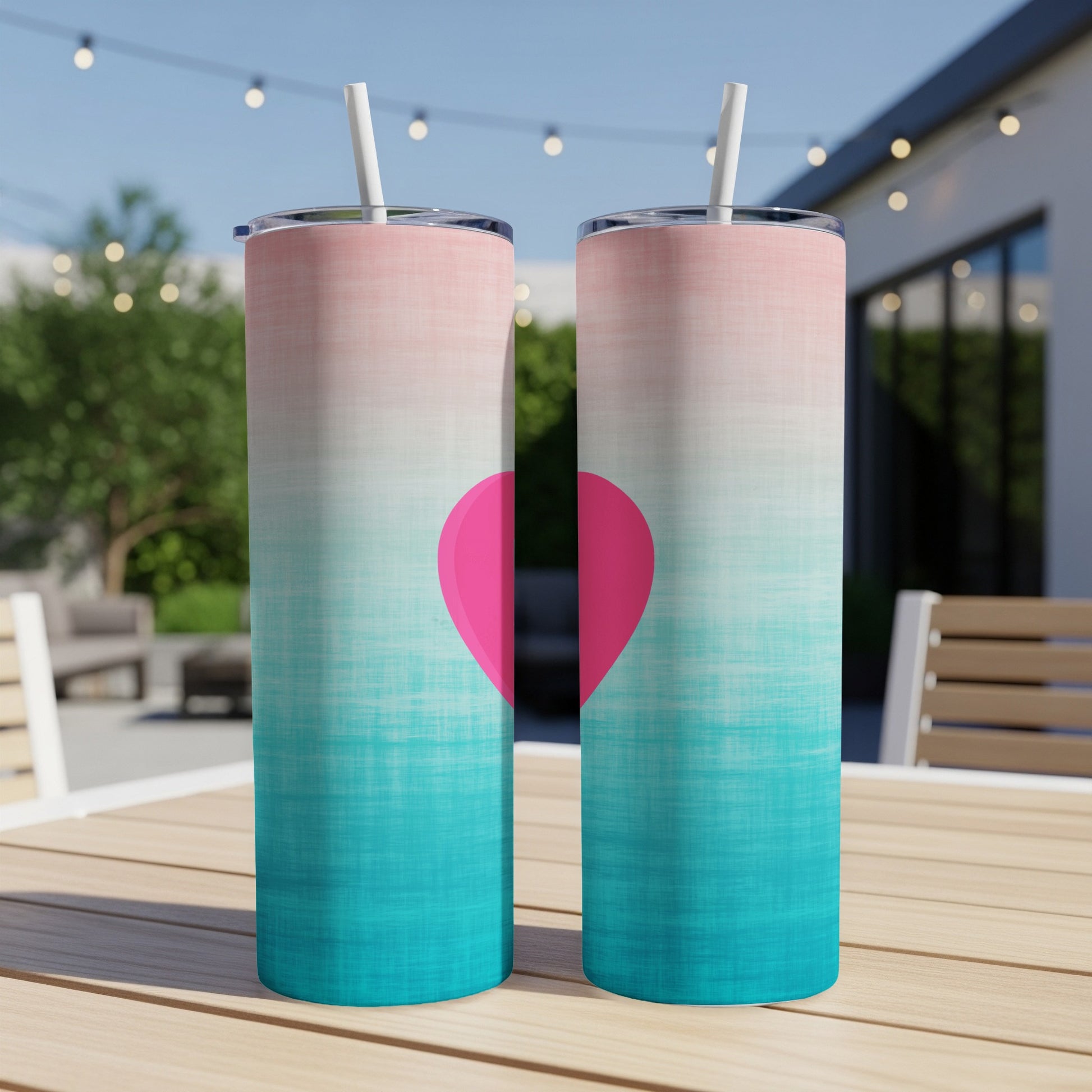 Two tall tumblers with pink and teal gradient, featuring a bright pink heart.