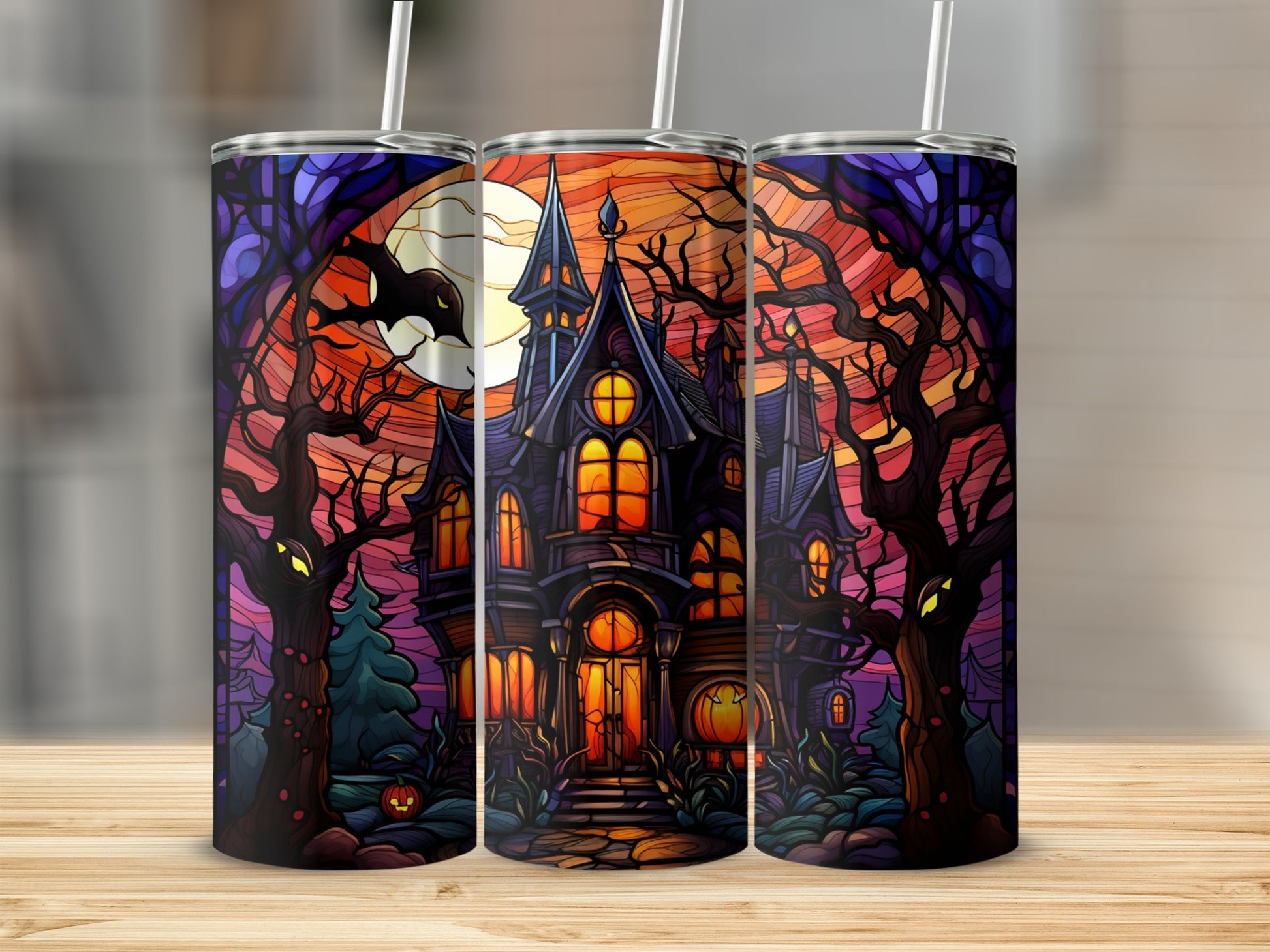 Haunted house with spooky trees and moon on a tumbler.