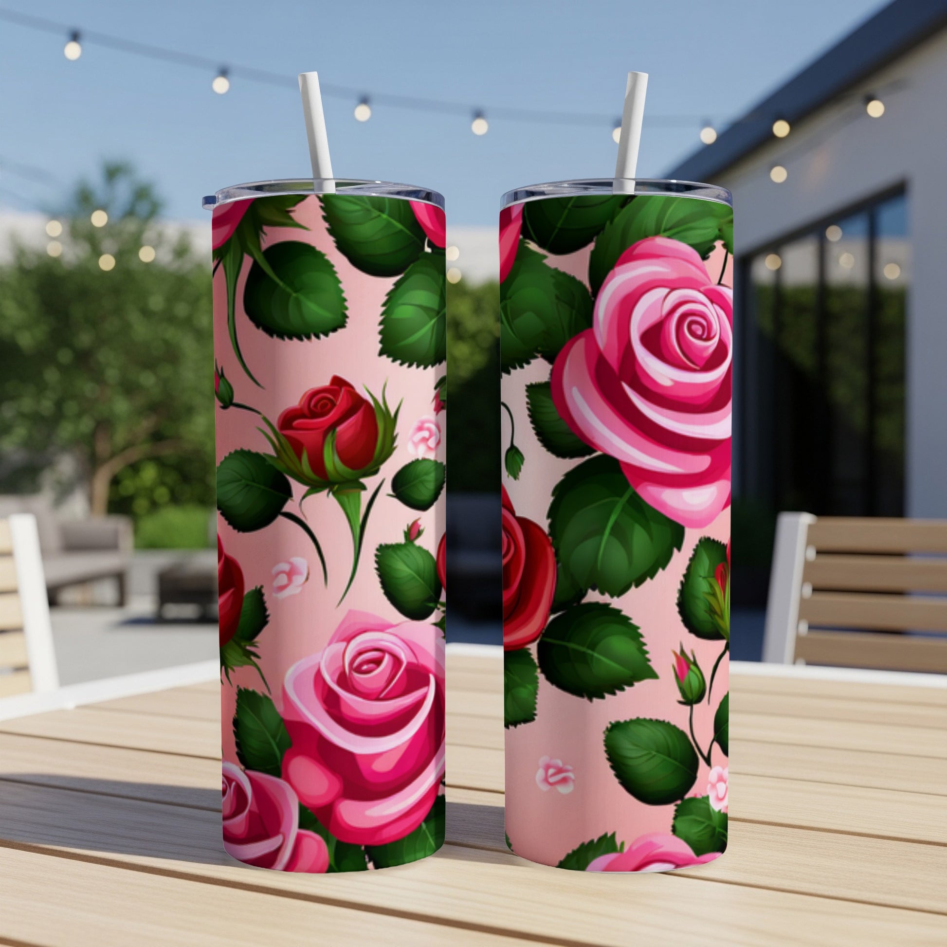 Two pink tumblers with red and pink rose floral pattern.