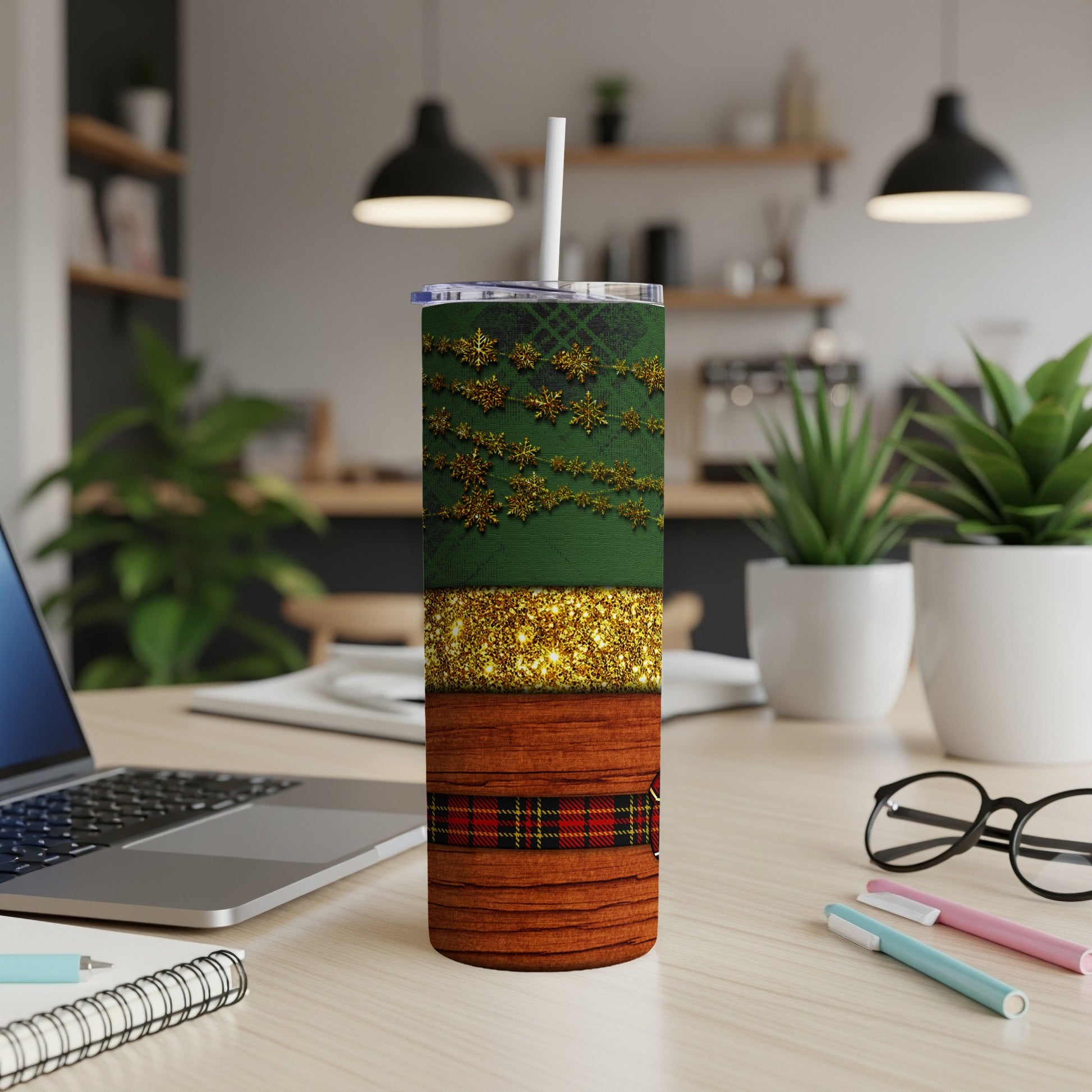 Green snowflake and gold glitter tumbler with wood grain pattern.