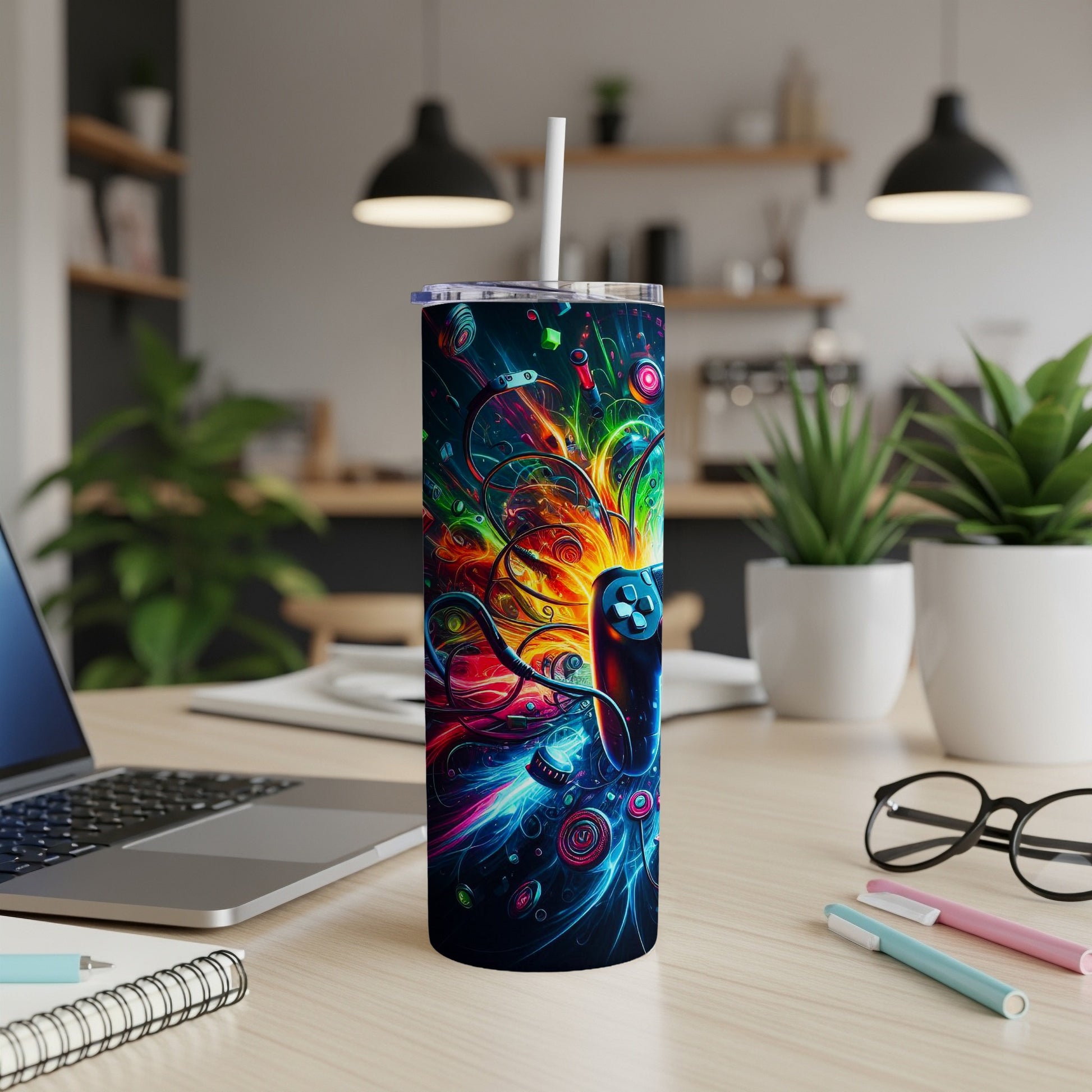 Black tumbler with a vibrant, abstract gaming controller design and straw.