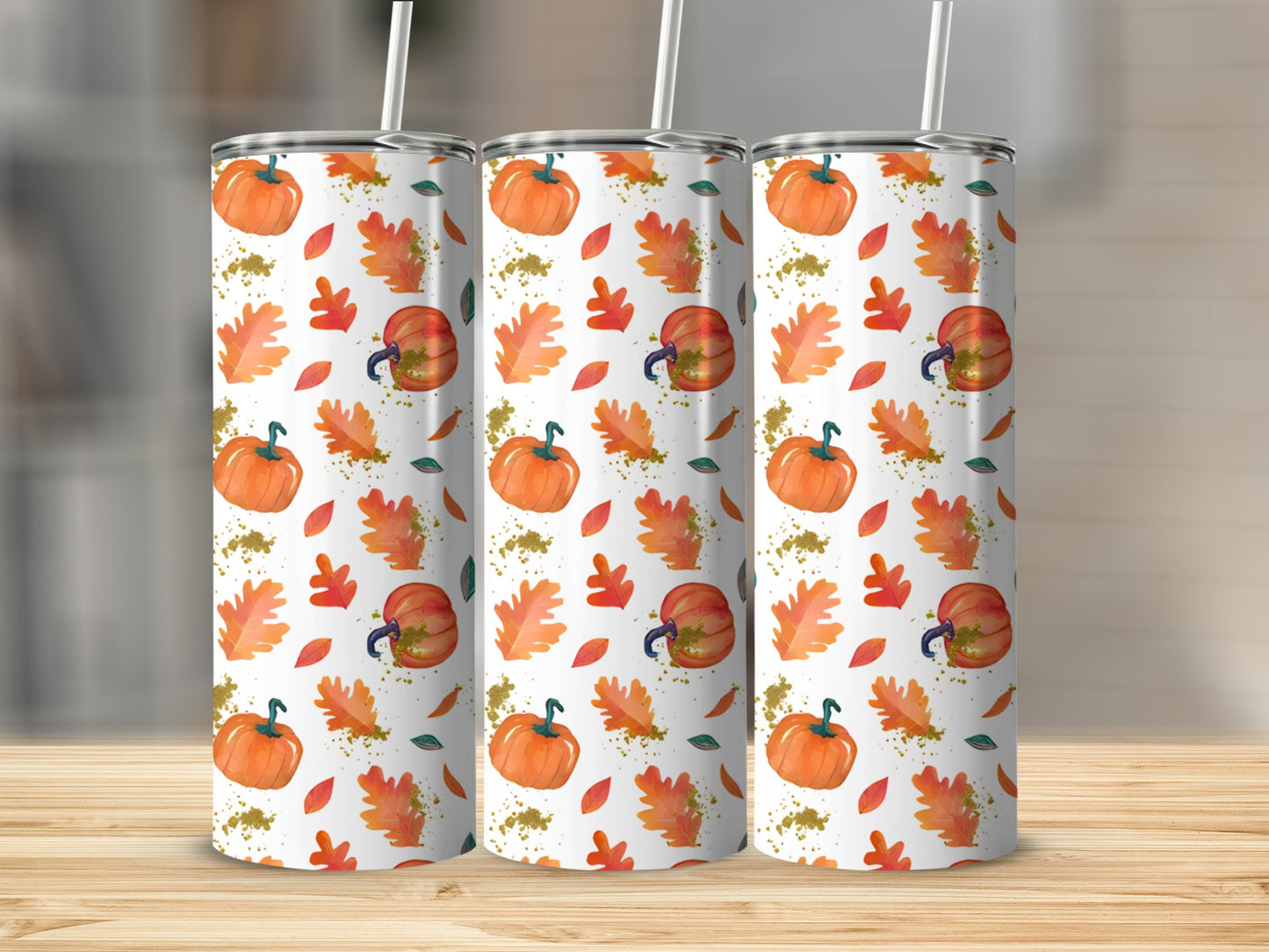 Three tumblers with a fall pumpkin and leaf pattern.