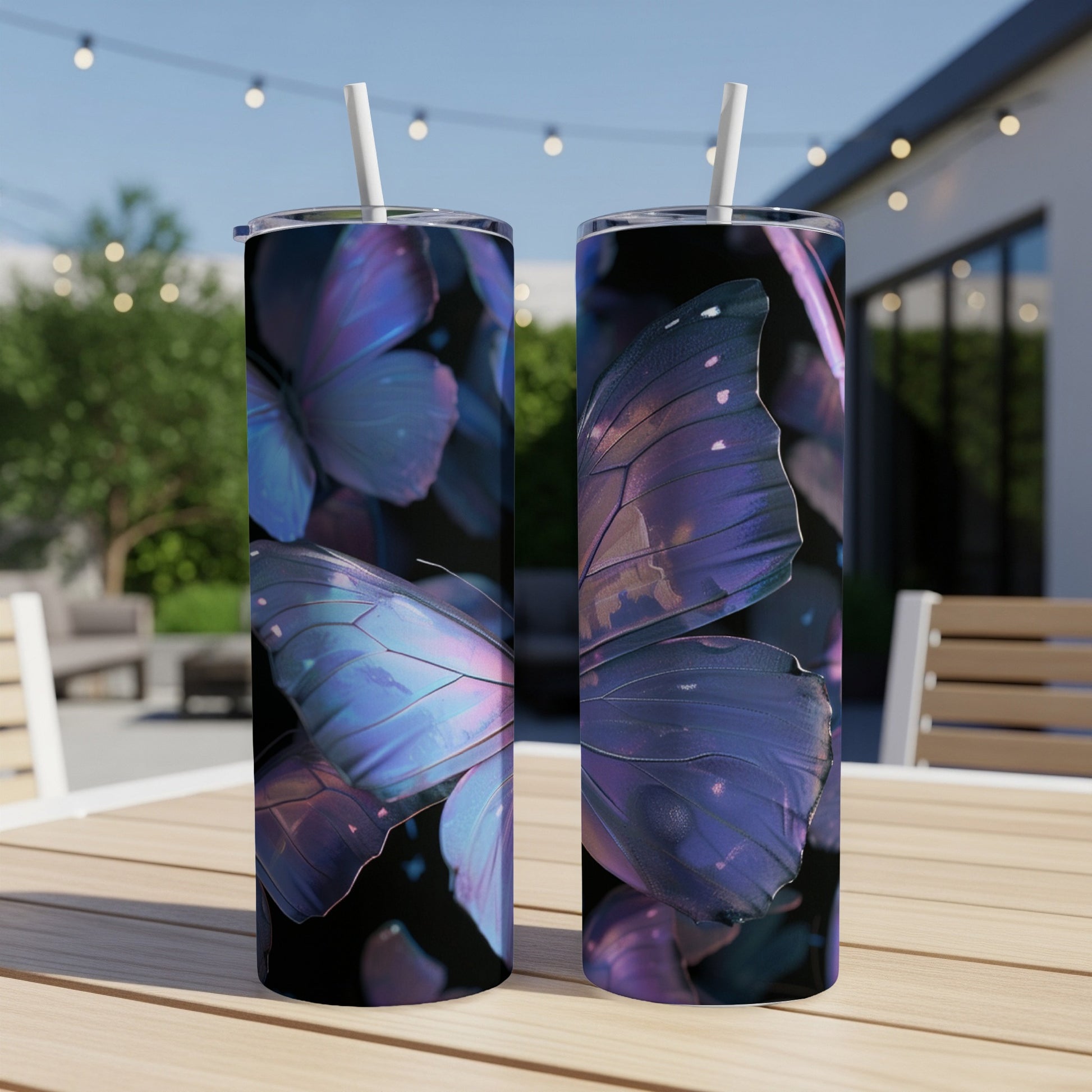 Two tumblers with iridescent purple butterfly wings design, on a wooden table.