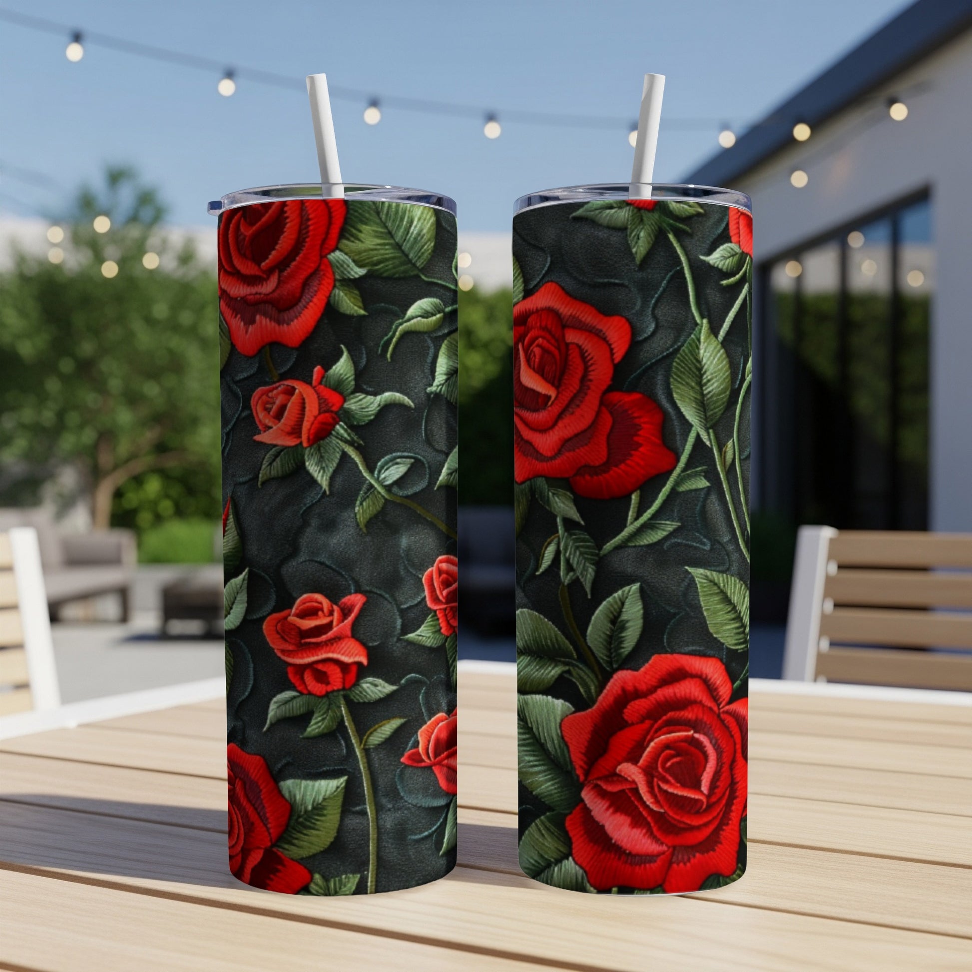 Two tumblers with red roses and dark floral pattern.