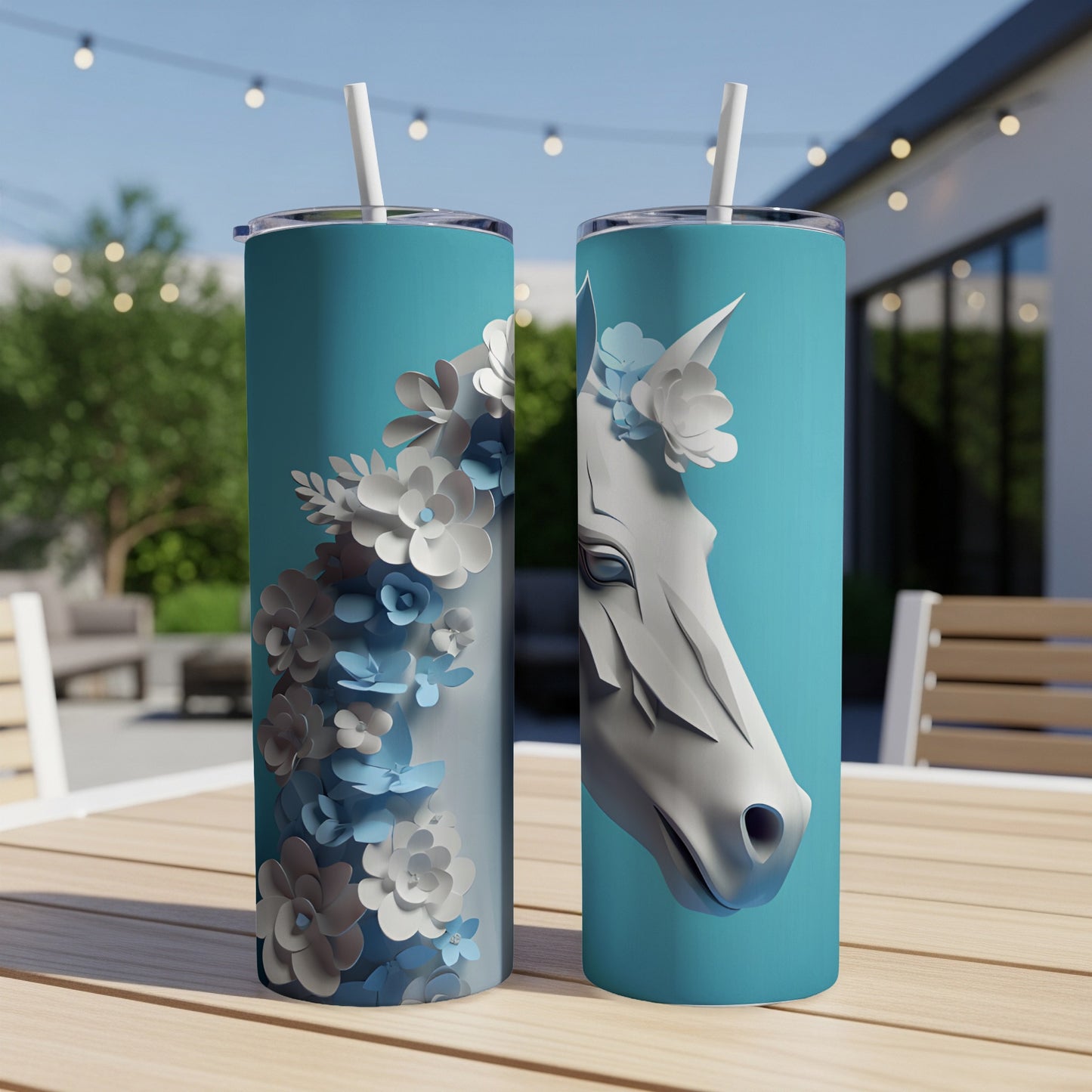 Two blue tumblers with a white horse head and floral accents.