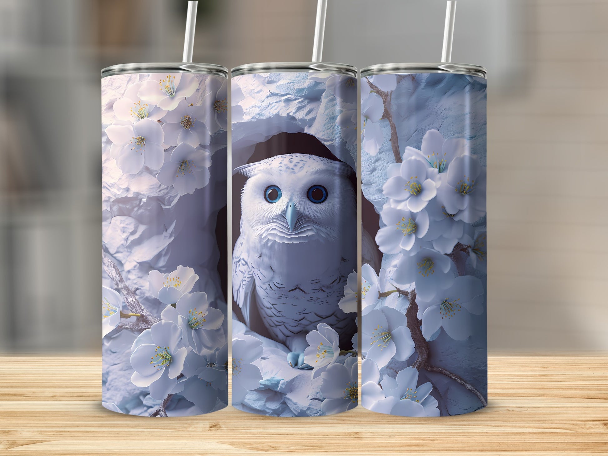White owl in snow-covered branches with white flowers, on a tumbler.