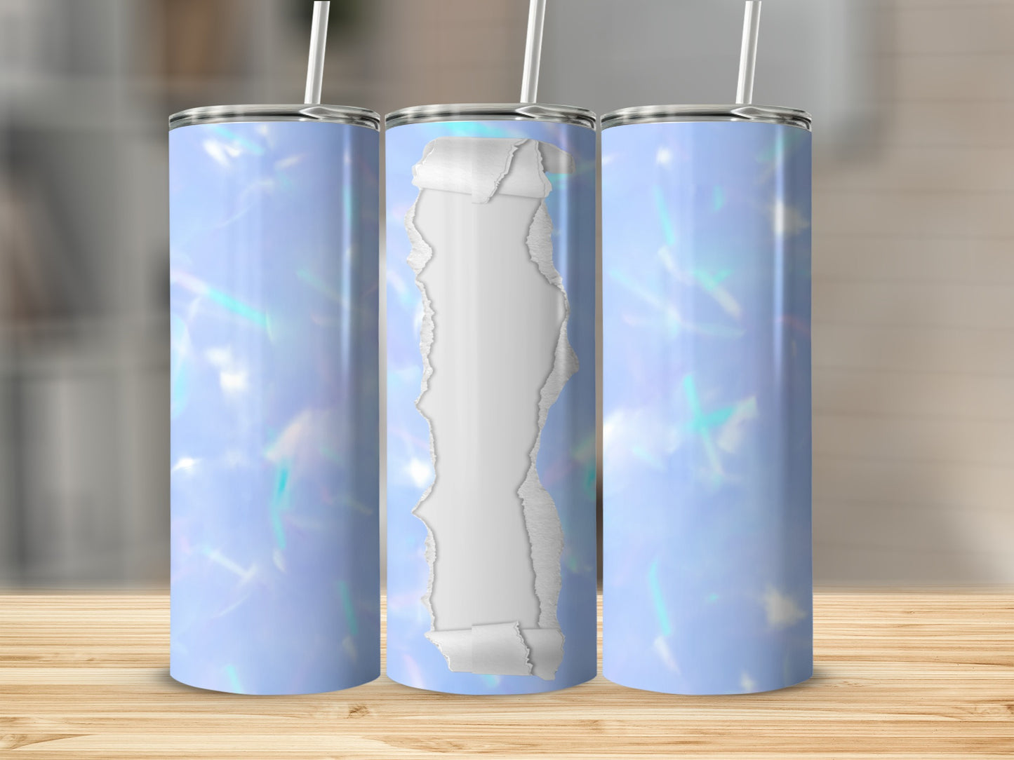 Three blue abstract patterned tumblers with ripped paper effect center design.