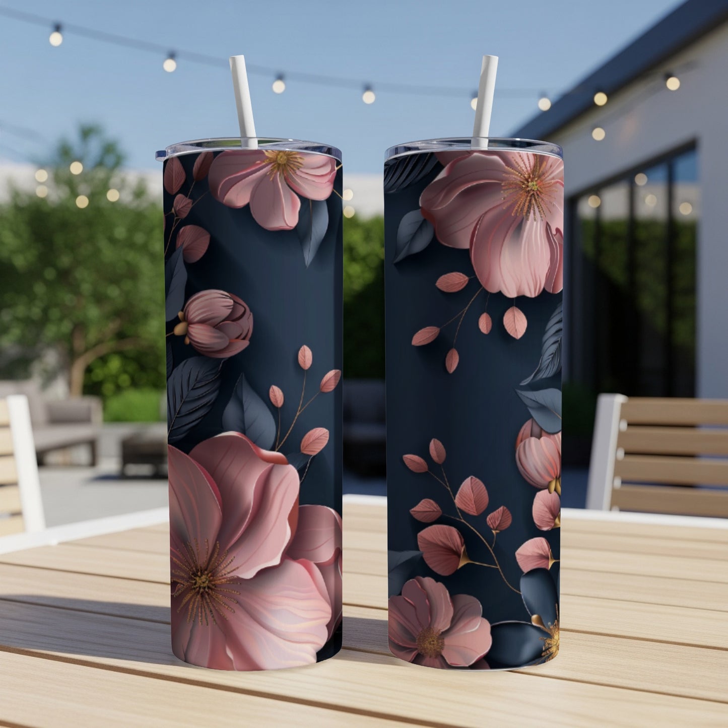 Dark blue tumblers with large pink floral designs and leaves.