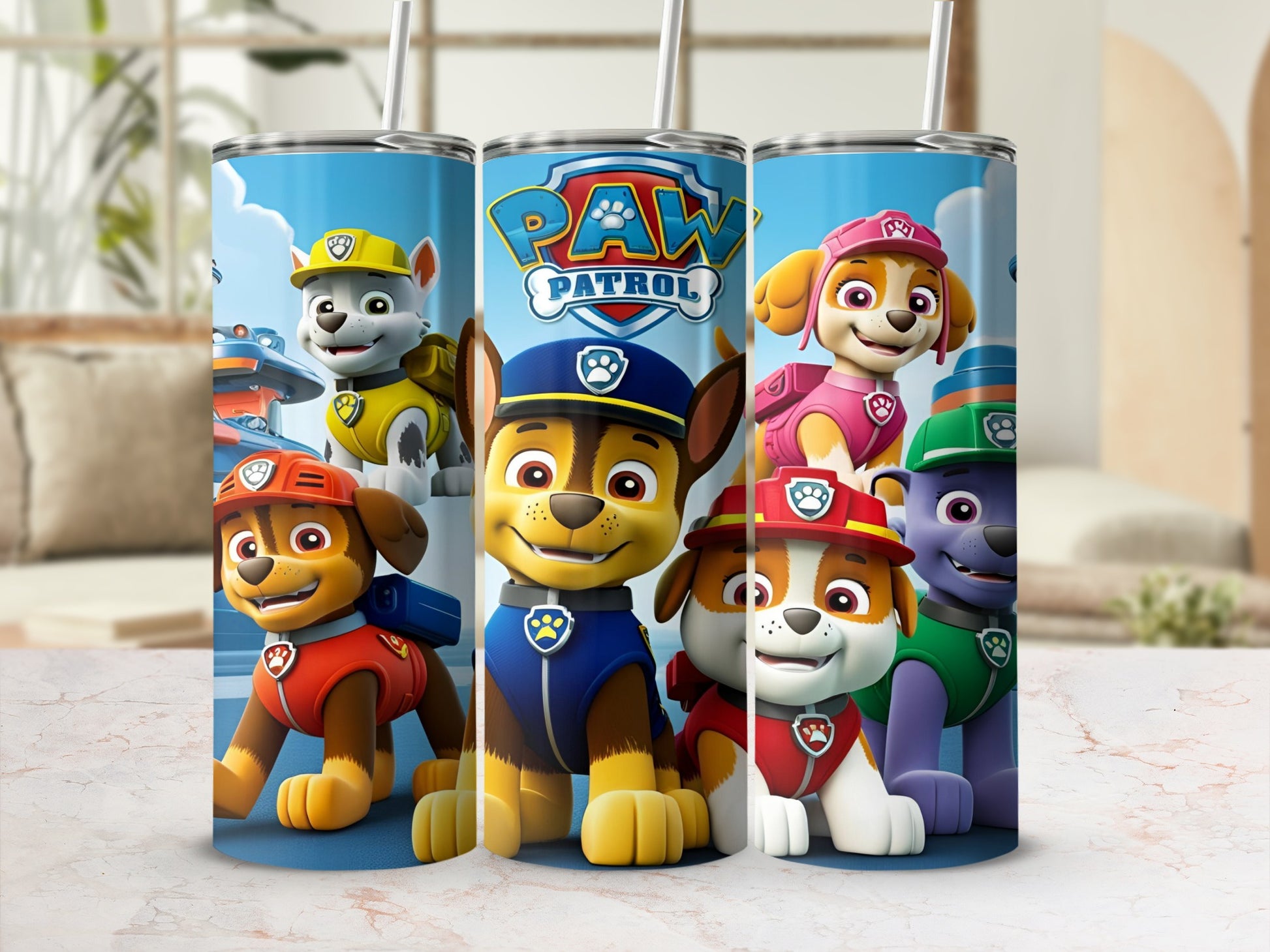 Paw Patrol characters Chase, Marshall, Rubble, Skye, and Everest on a blue tumbler.