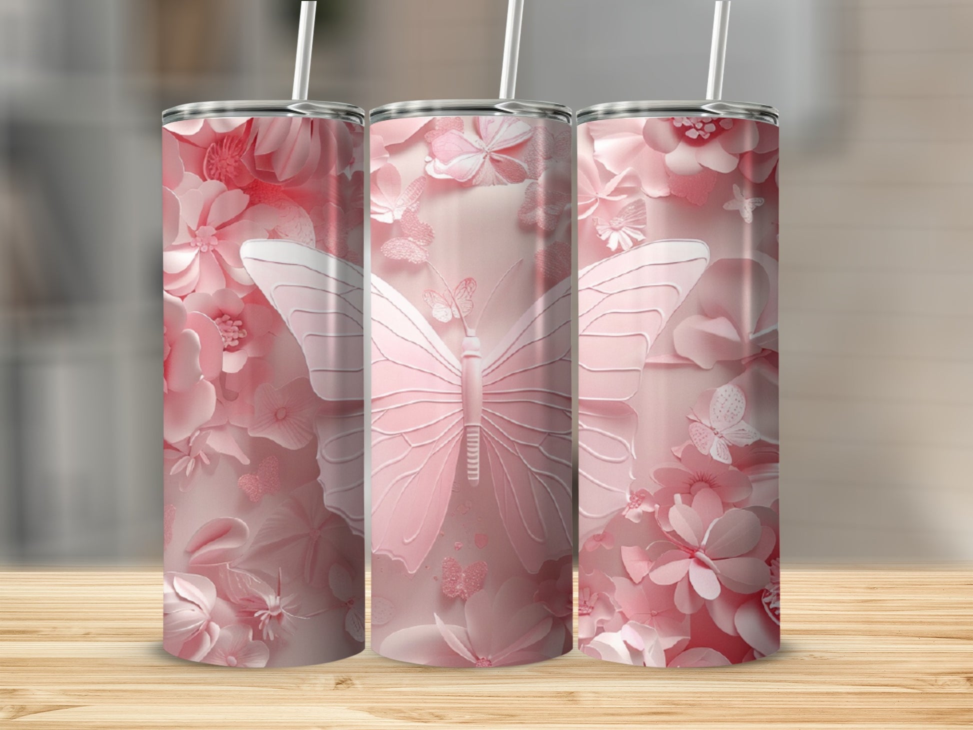 Pink floral tumbler with a large butterfly graphic.