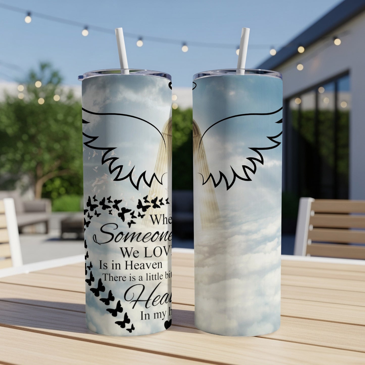 In loving memory tumbler with angel wings and flying butterflies.