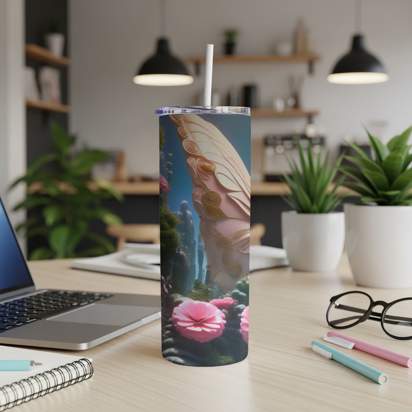 Pink butterfly wing pattern on a tall tumbler with a straw.