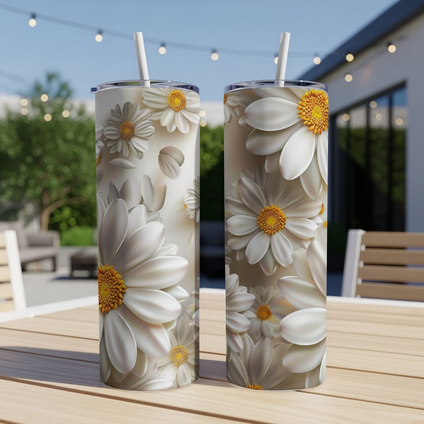 Two tall tumblers with a white daisy floral pattern.