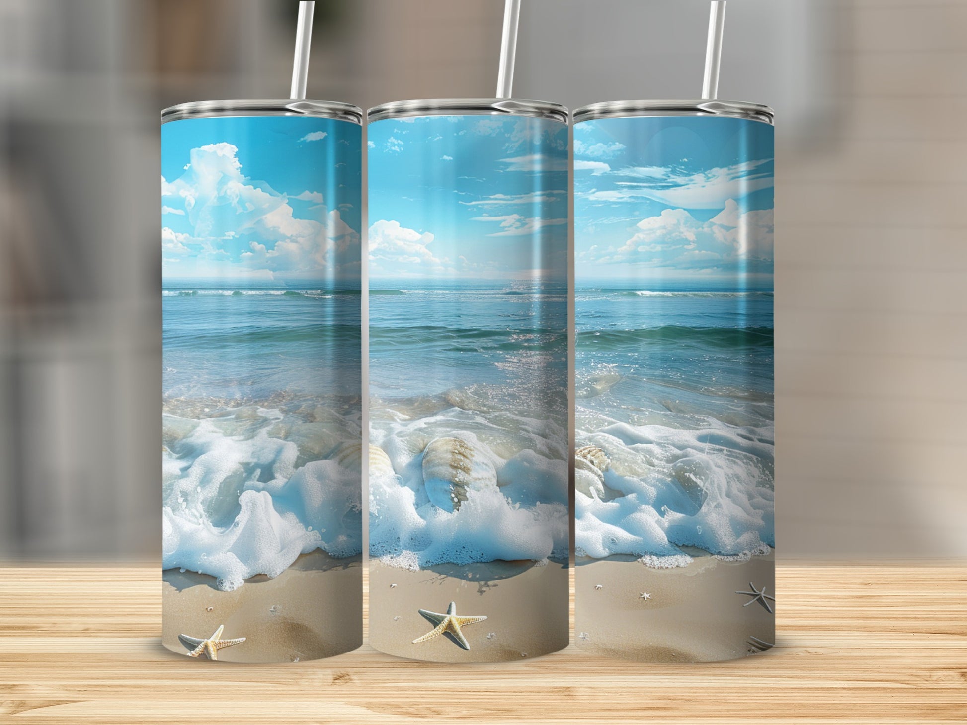 Three tumblers featuring a beach scene with shells and starfish.