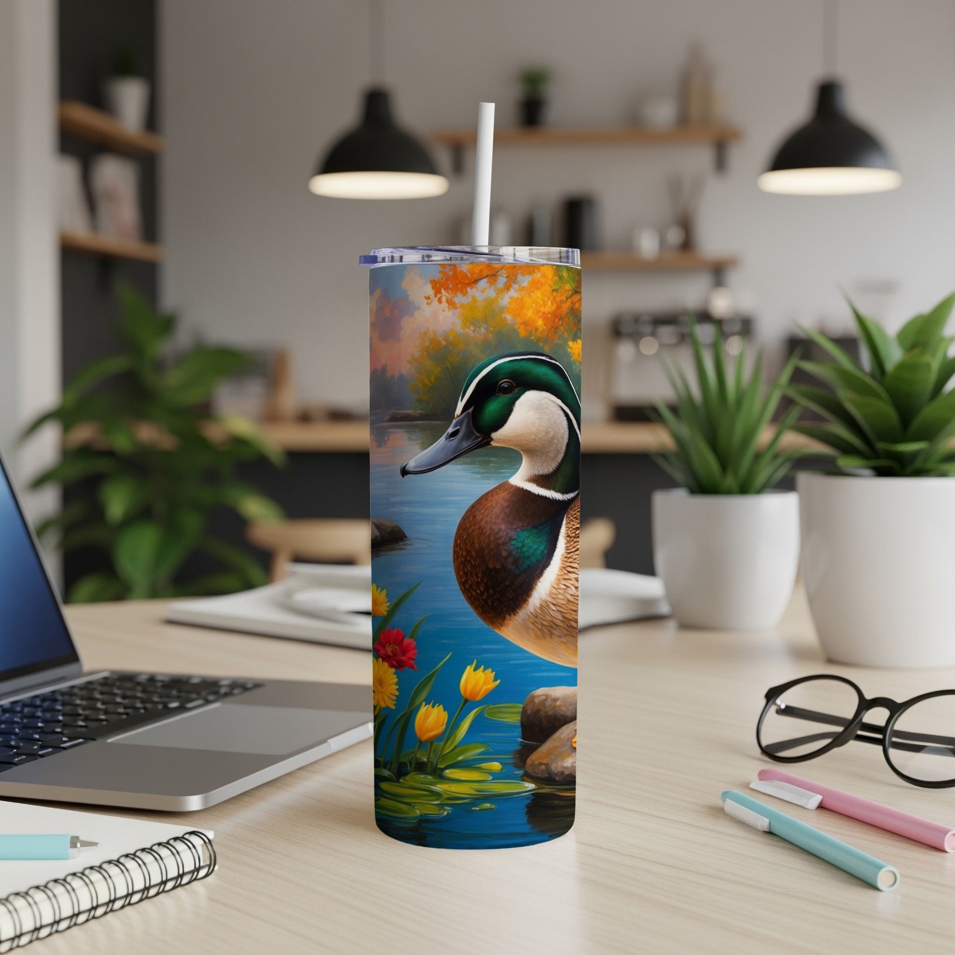Ducks on water with colorful flowers on a tumbler.