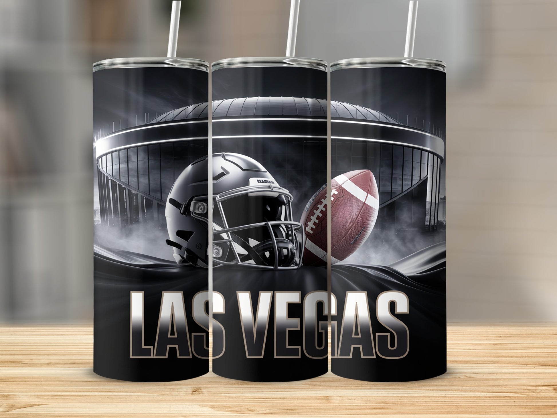 Las Vegas Raiders helmet and football in front of stadium.