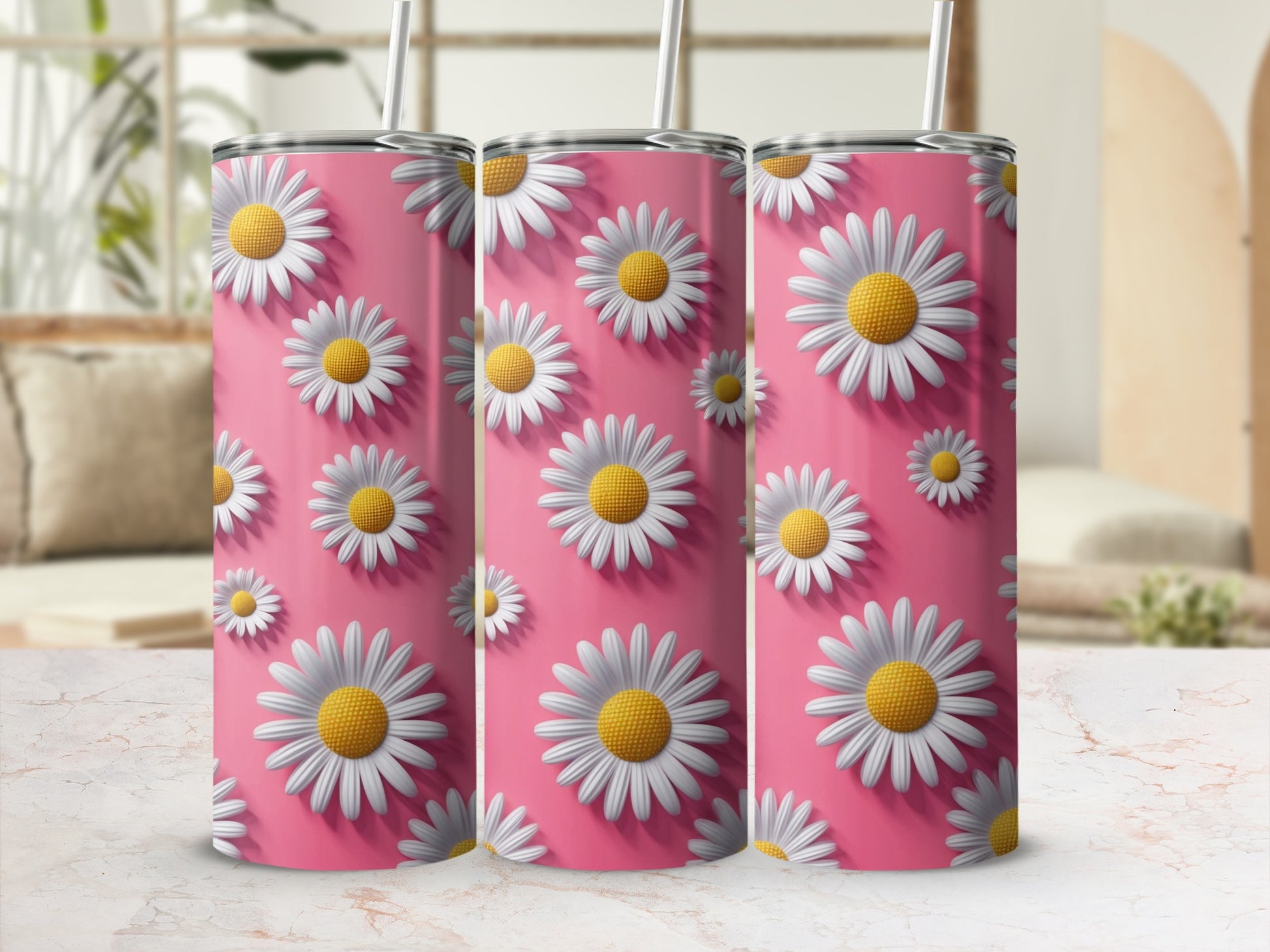 Three tumblers with a pink background and white daisy floral pattern.