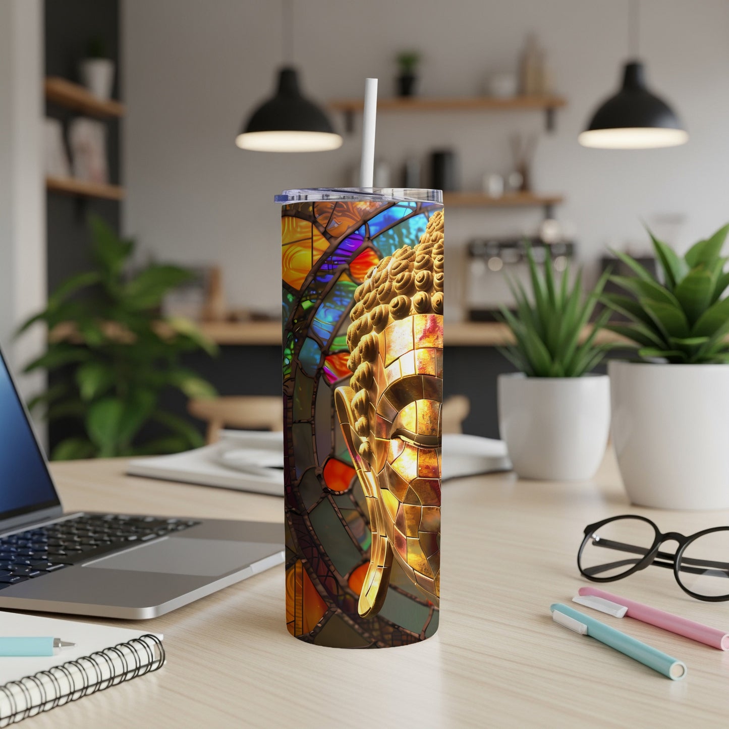 Stained glass Buddha head on a stainless steel tumbler.