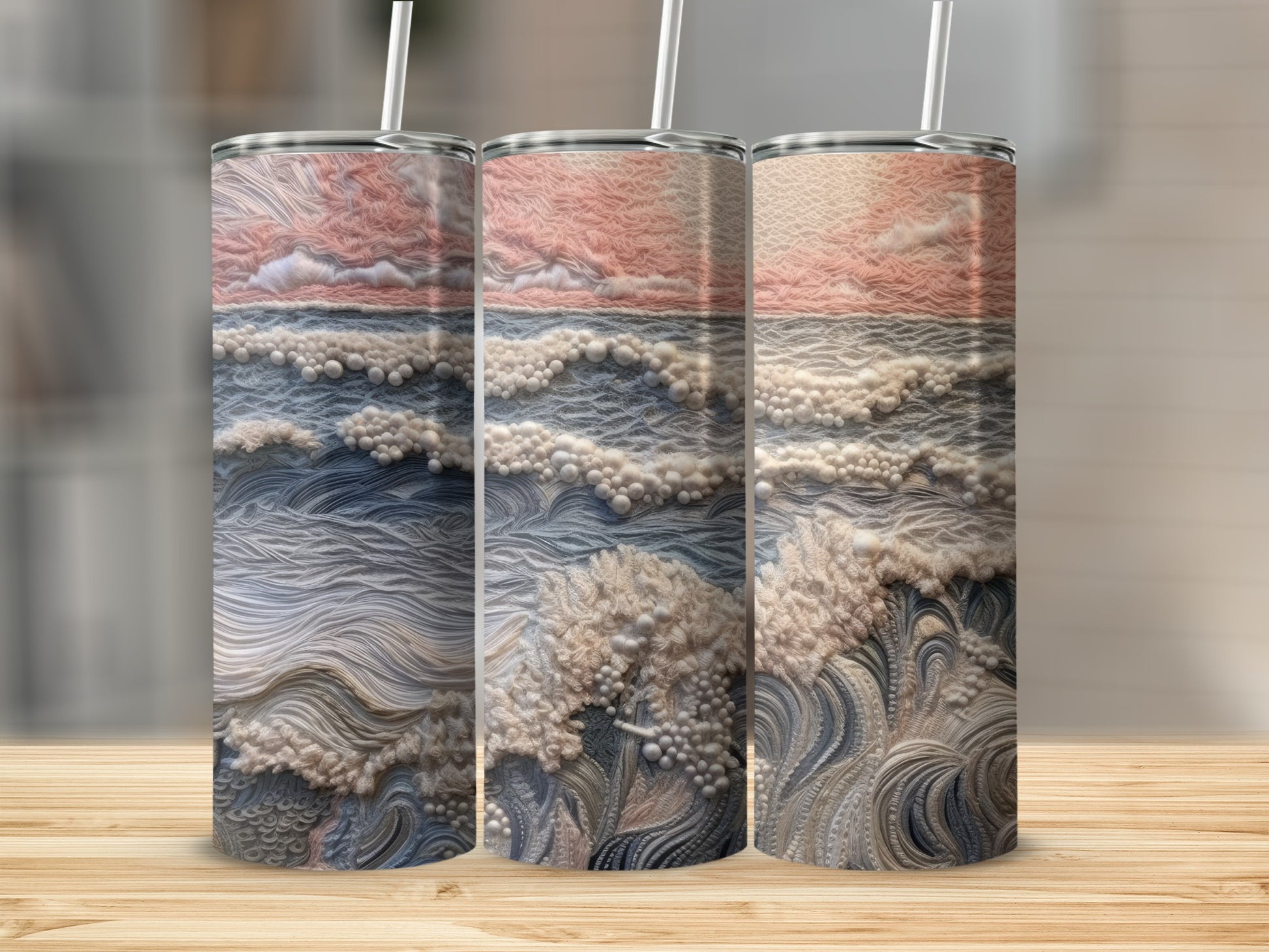 Three tumblers with abstract ocean wave and sky design.