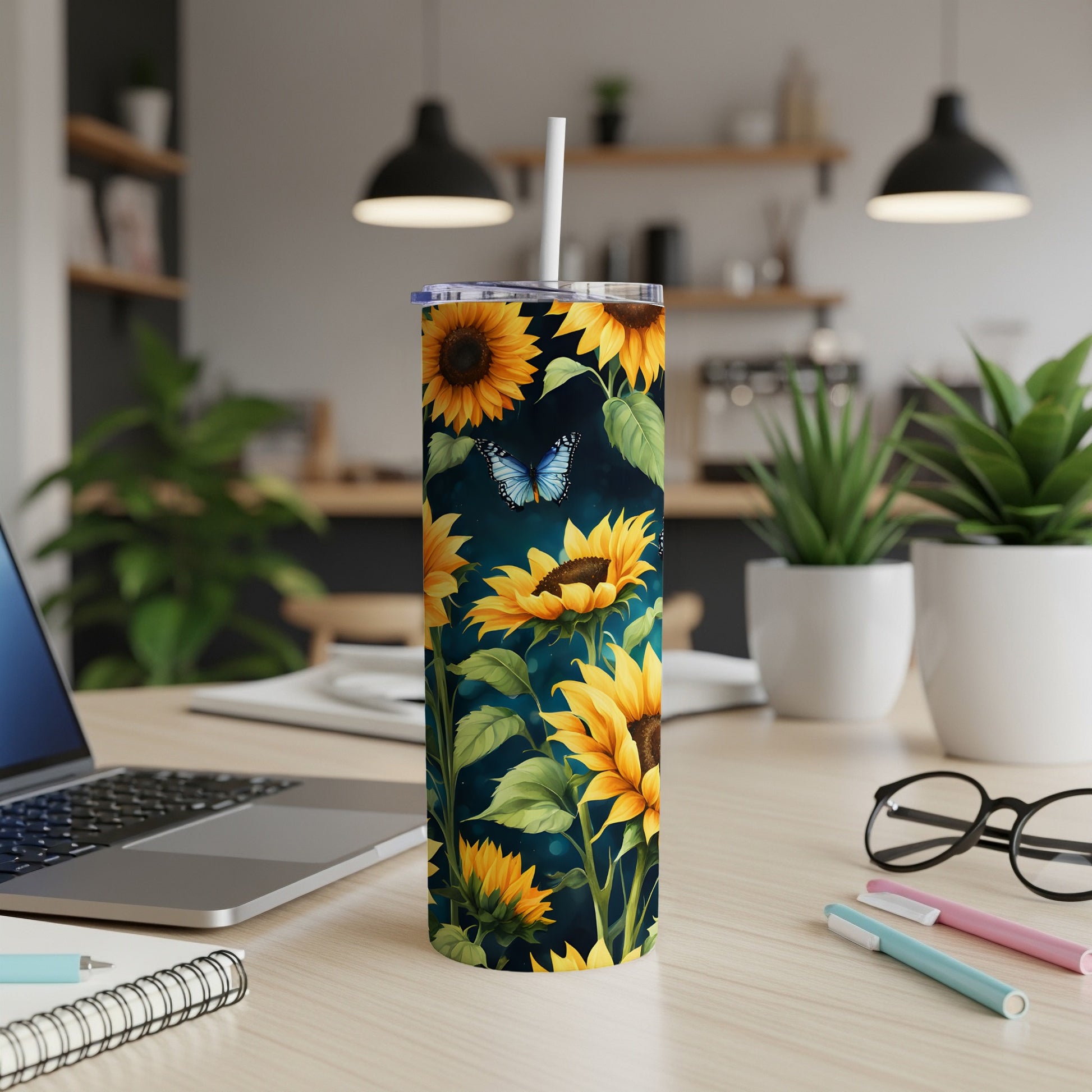 Tall tumbler with sunflowers and a blue butterfly design.
