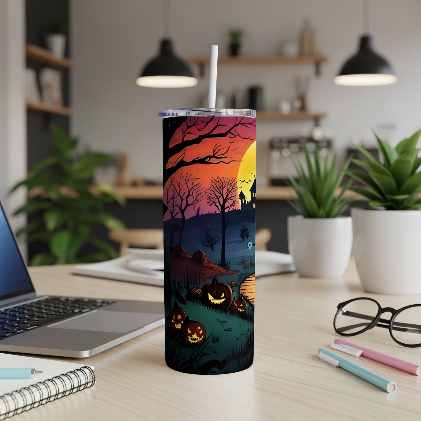 Tumbler with a spooky Halloween scene featuring jack-o'-lanterns and a haunted house.