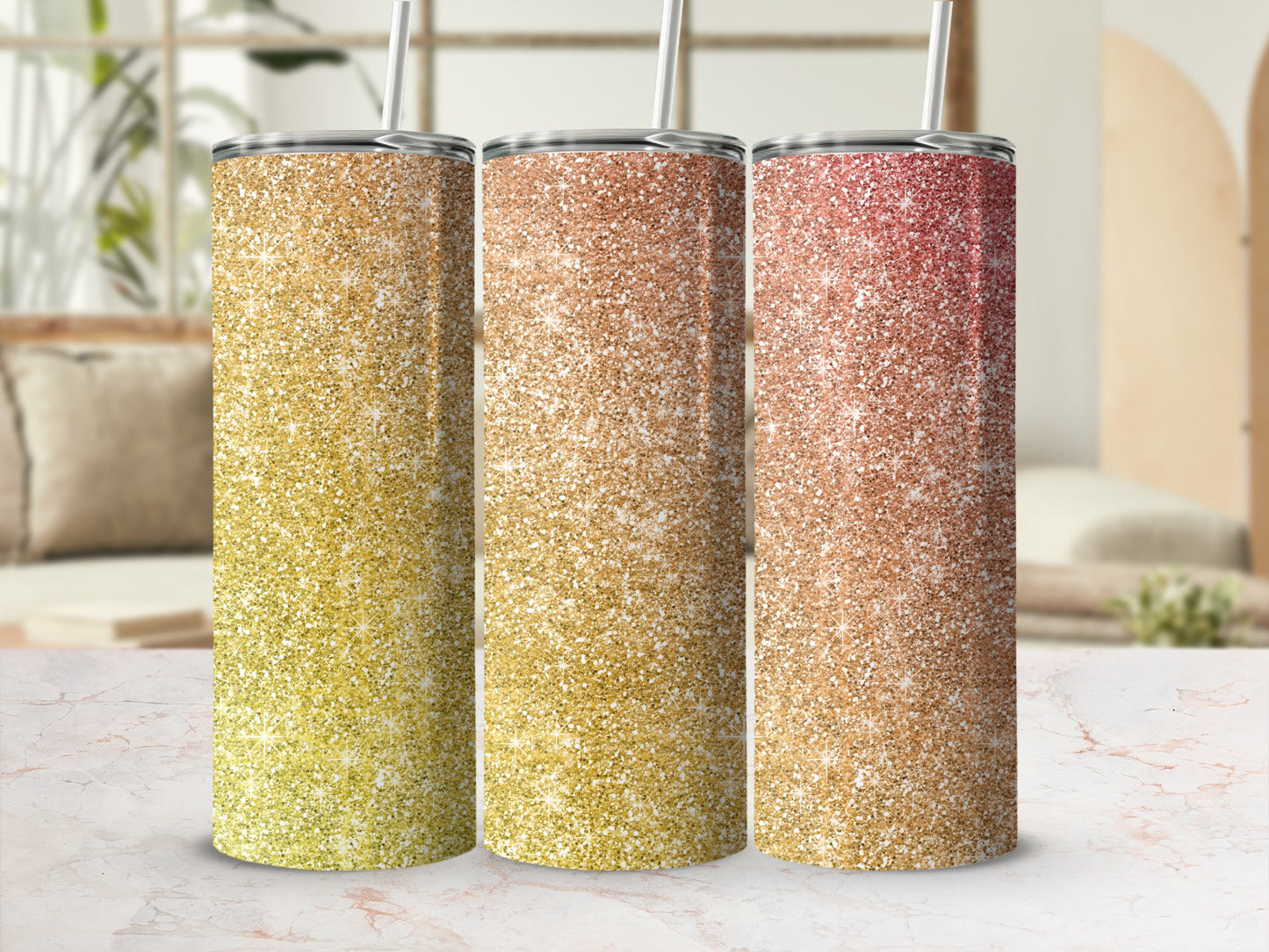 Three glitter tumblers with straws: yellow, rose gold, and red hues.
