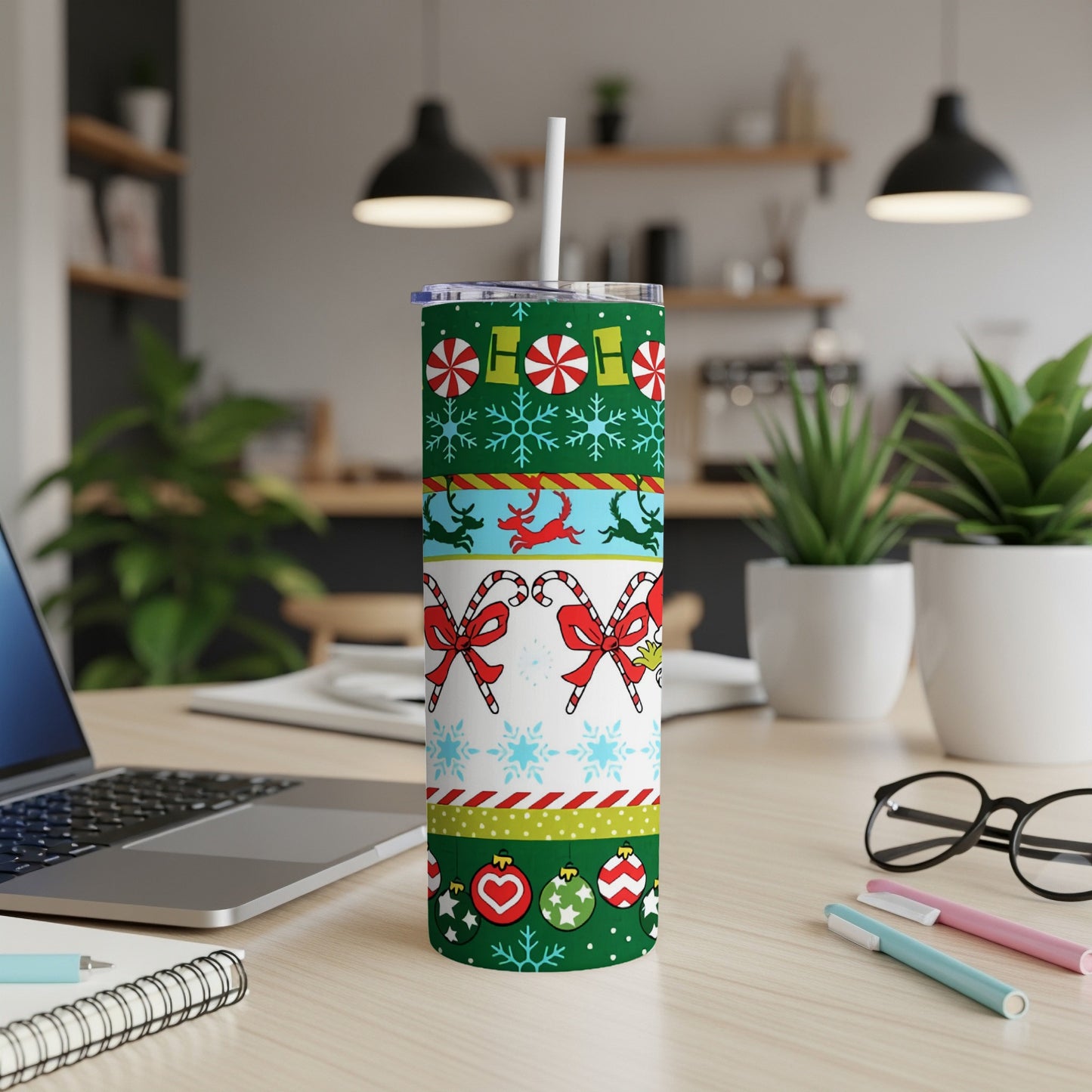 Christmas tumbler with candy canes, snowflakes, and festive patterns.