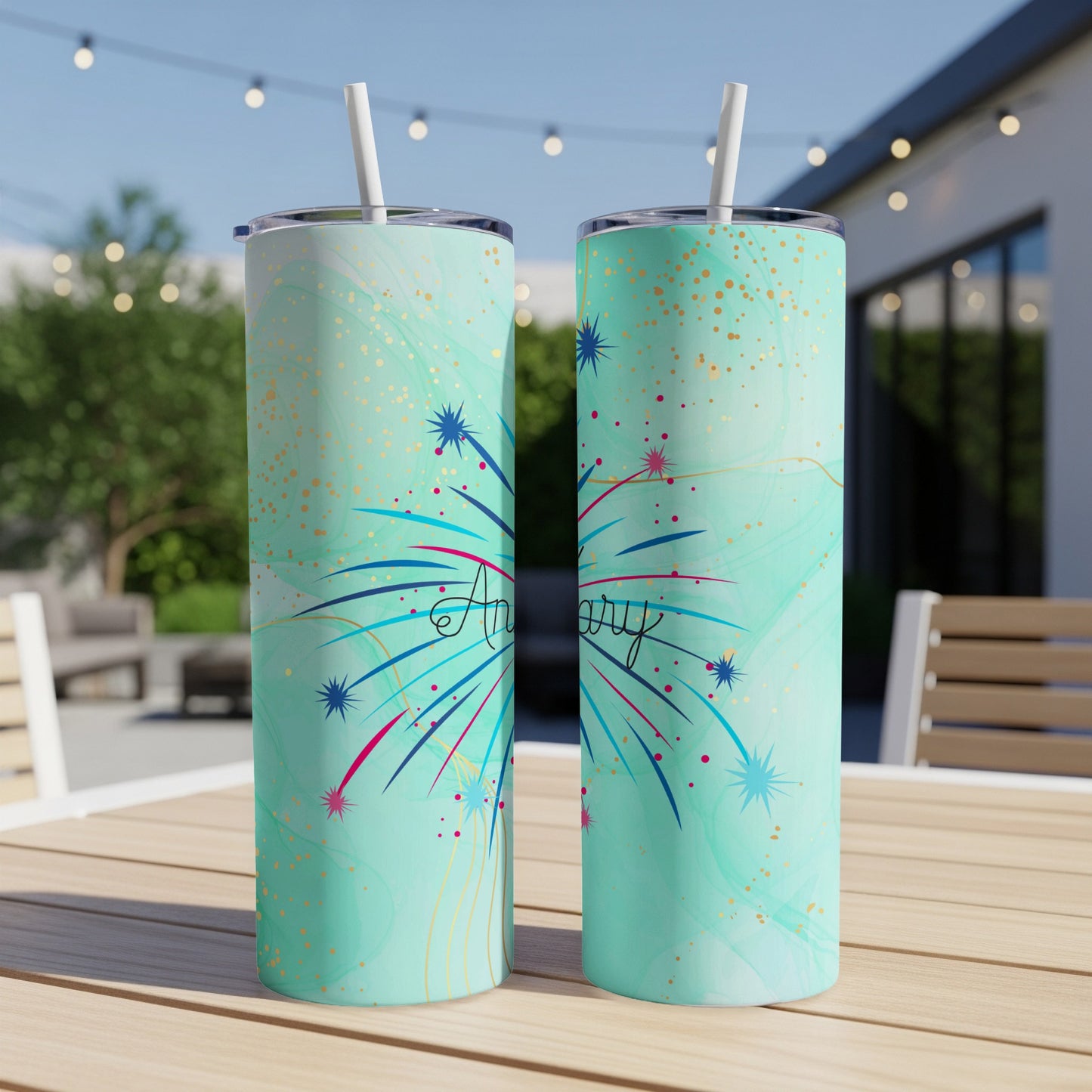 Two teal tumblers with fireworks and "Anniversary" text.