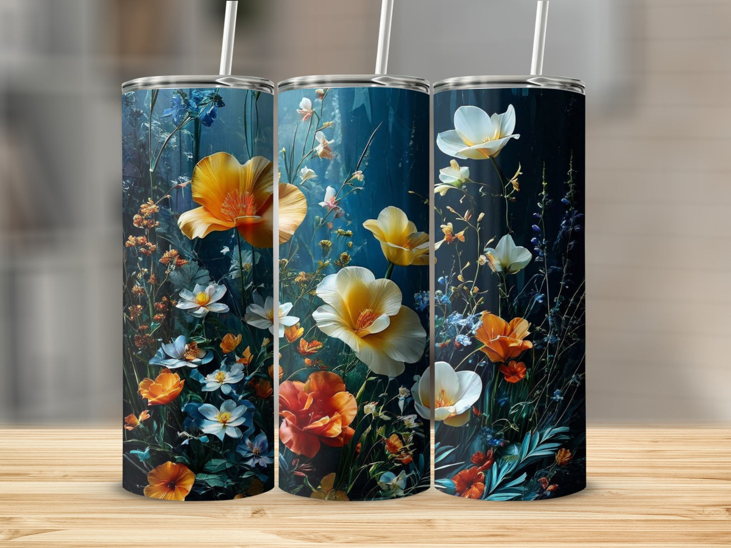 Three tumblers with vibrant wildflowers on a dark blue background.