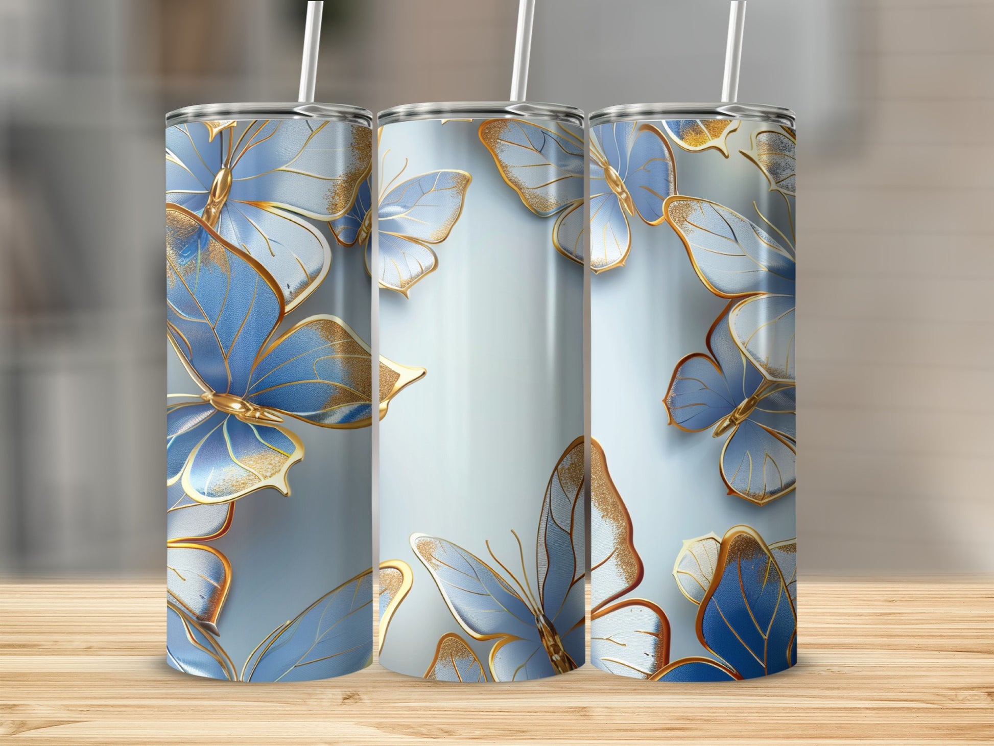 Three tumblers with blue and gold butterfly pattern.