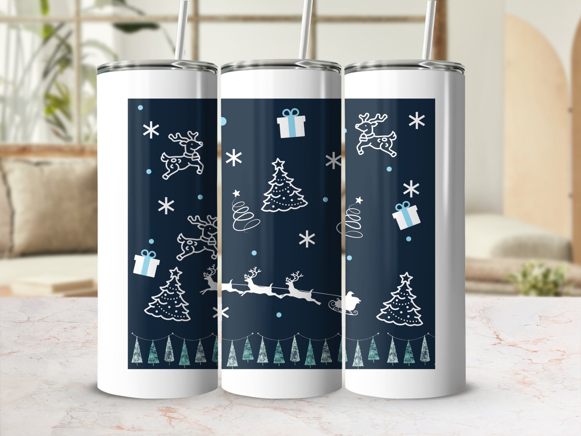 Three white tumblers with a dark blue Christmas design.