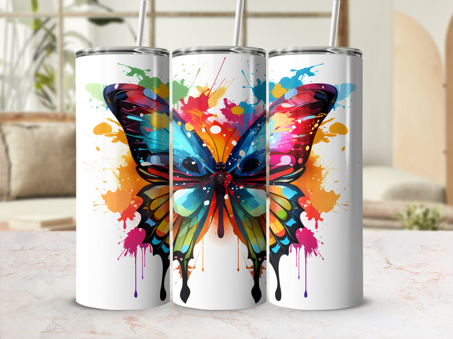 White tumblers with vibrant butterfly splatter art.