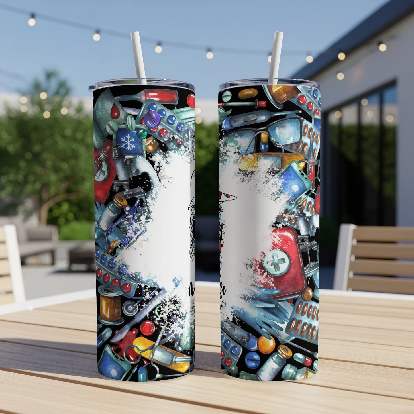Two tumblers adorned with medical icons and colorful pills, displayed on a table.