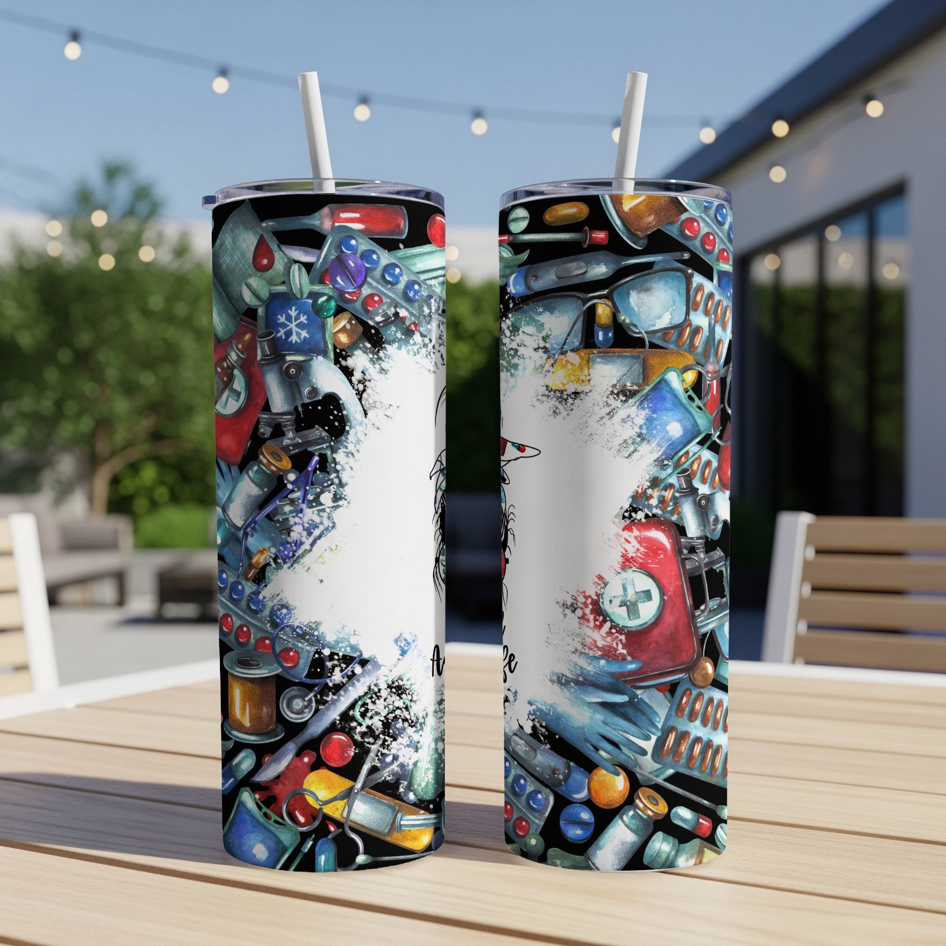 Two tumblers adorned with medical icons and colorful pills, displayed on a table.