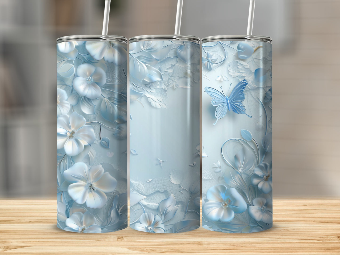 Light blue tumbler with white floral and butterfly design.