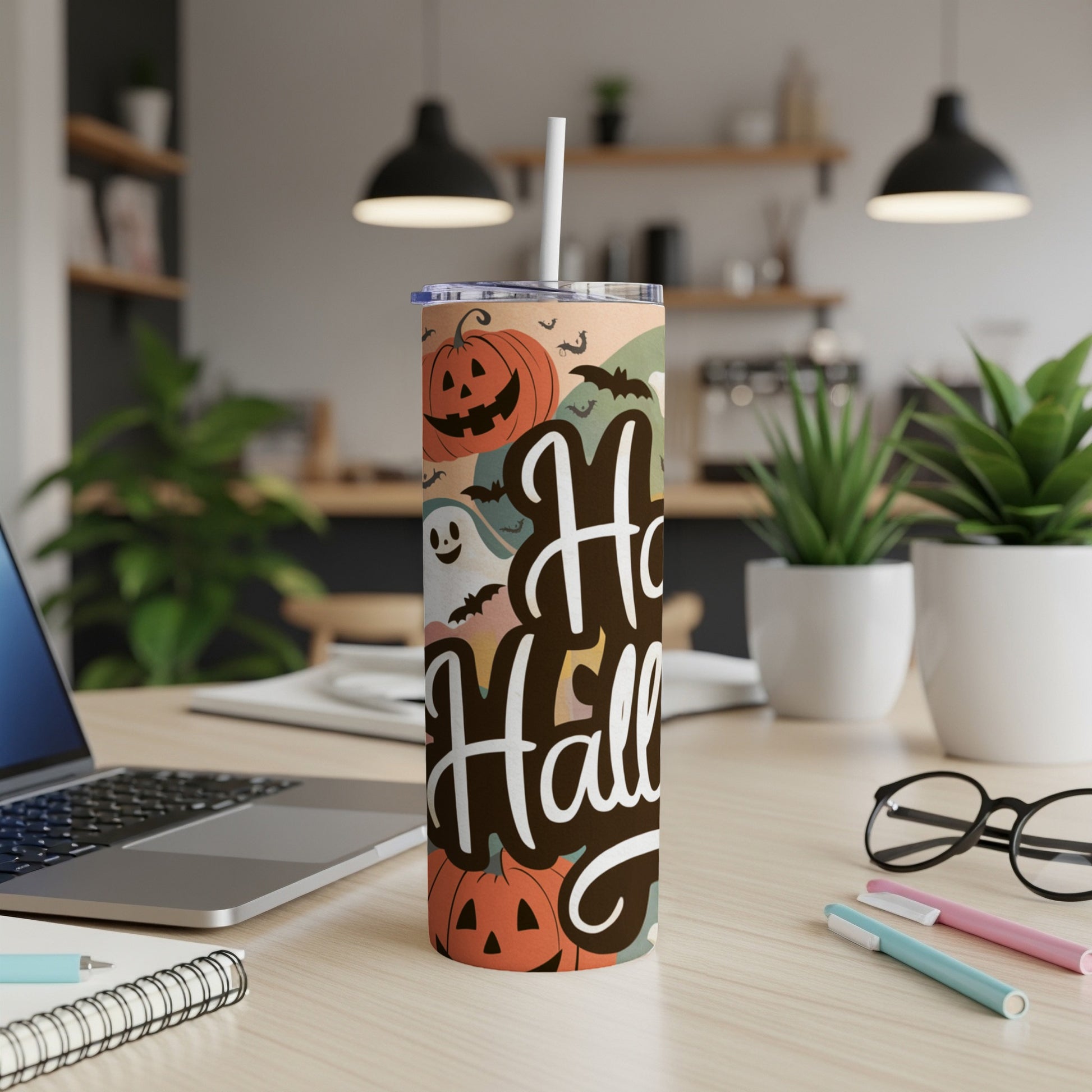 Tumbler with "Happy Halloween" text and pumpkin, ghost, and bat graphics.