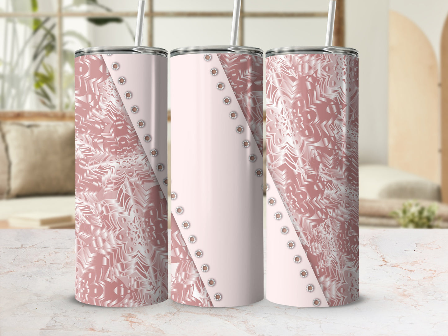 Rose gold tumbler with decorative embossed pattern and silver studs.
