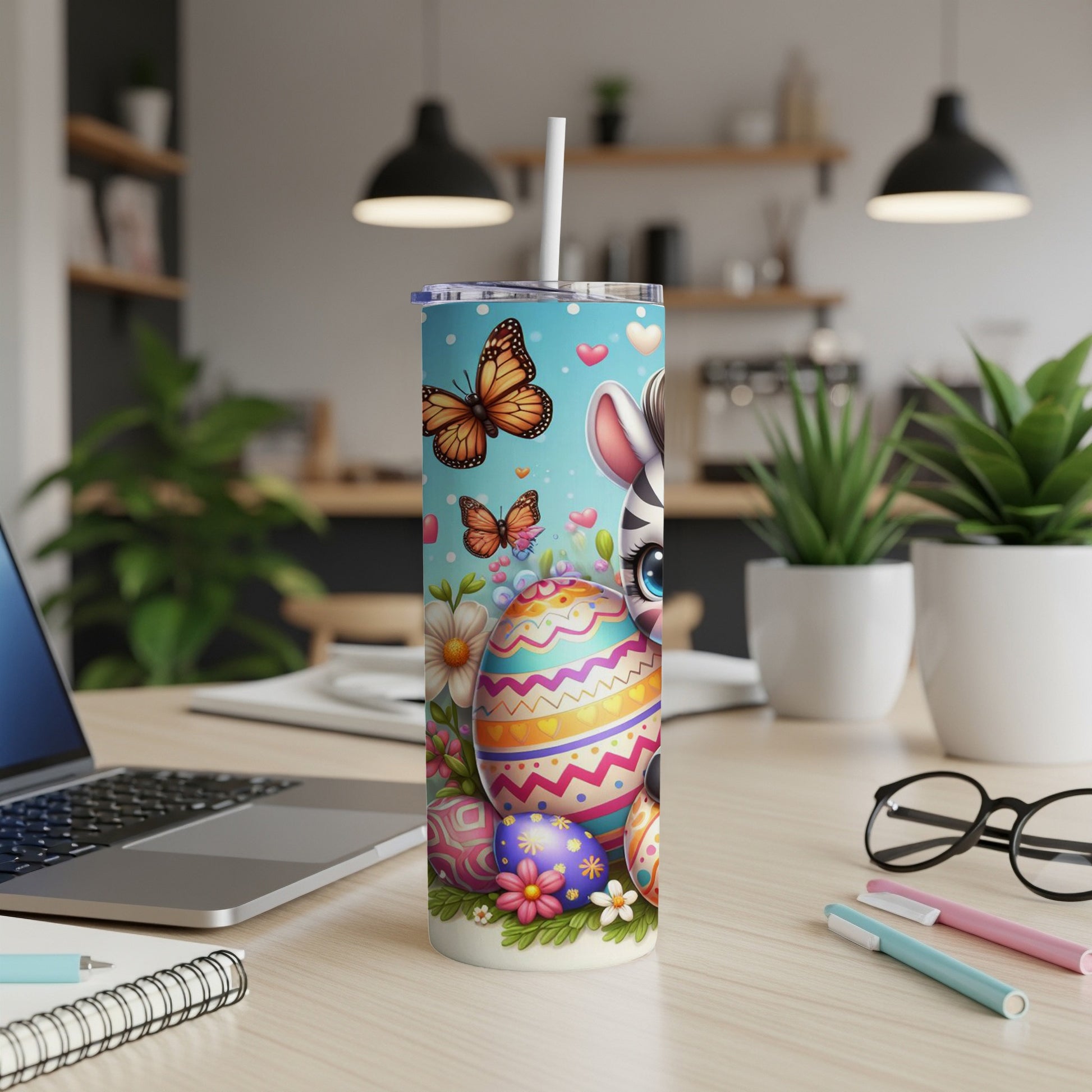 Easter tumbler with zebra, butterflies, and decorated eggs.