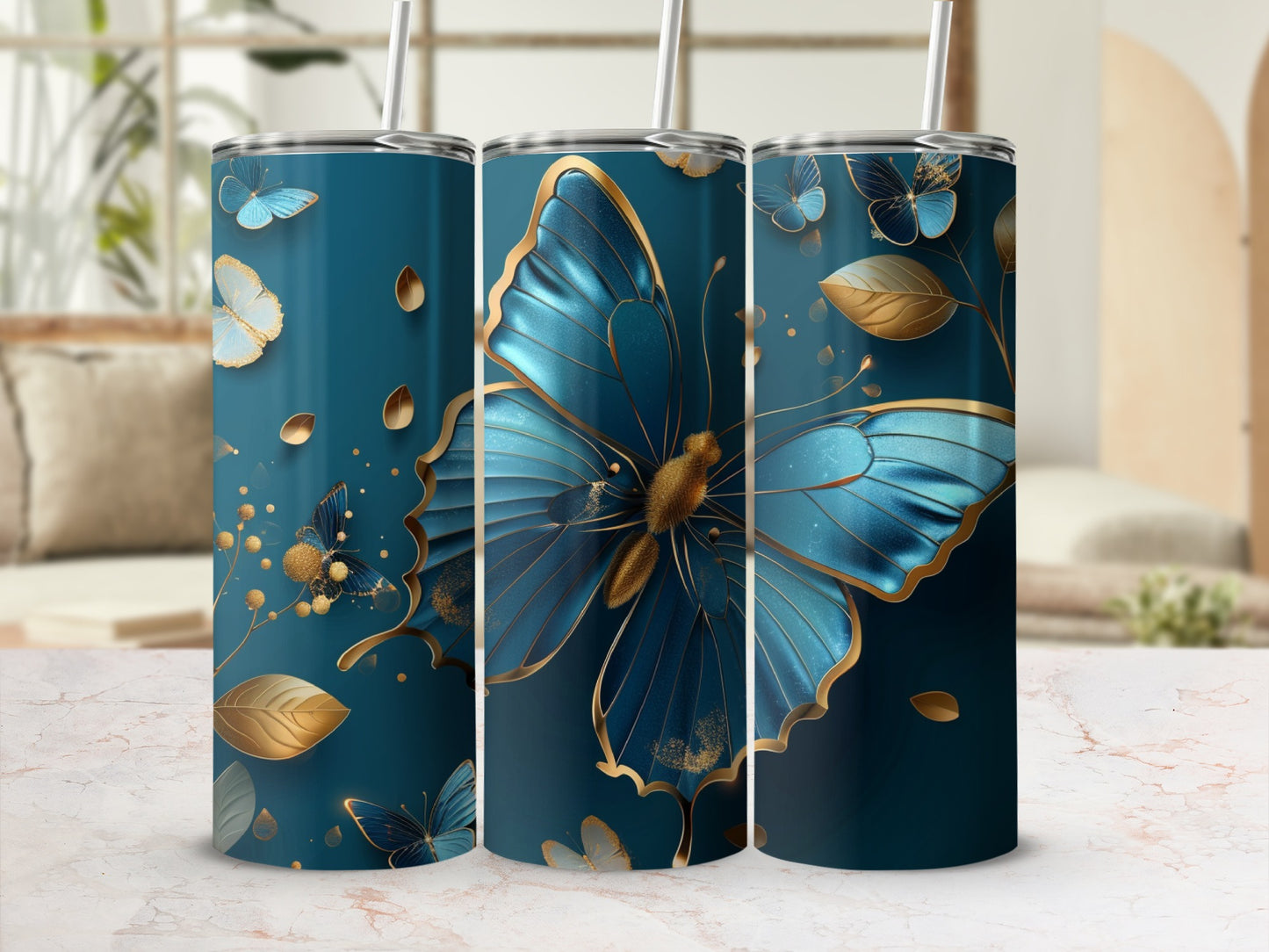 Three teal tumblers adorned with blue and gold butterflies and leaves.