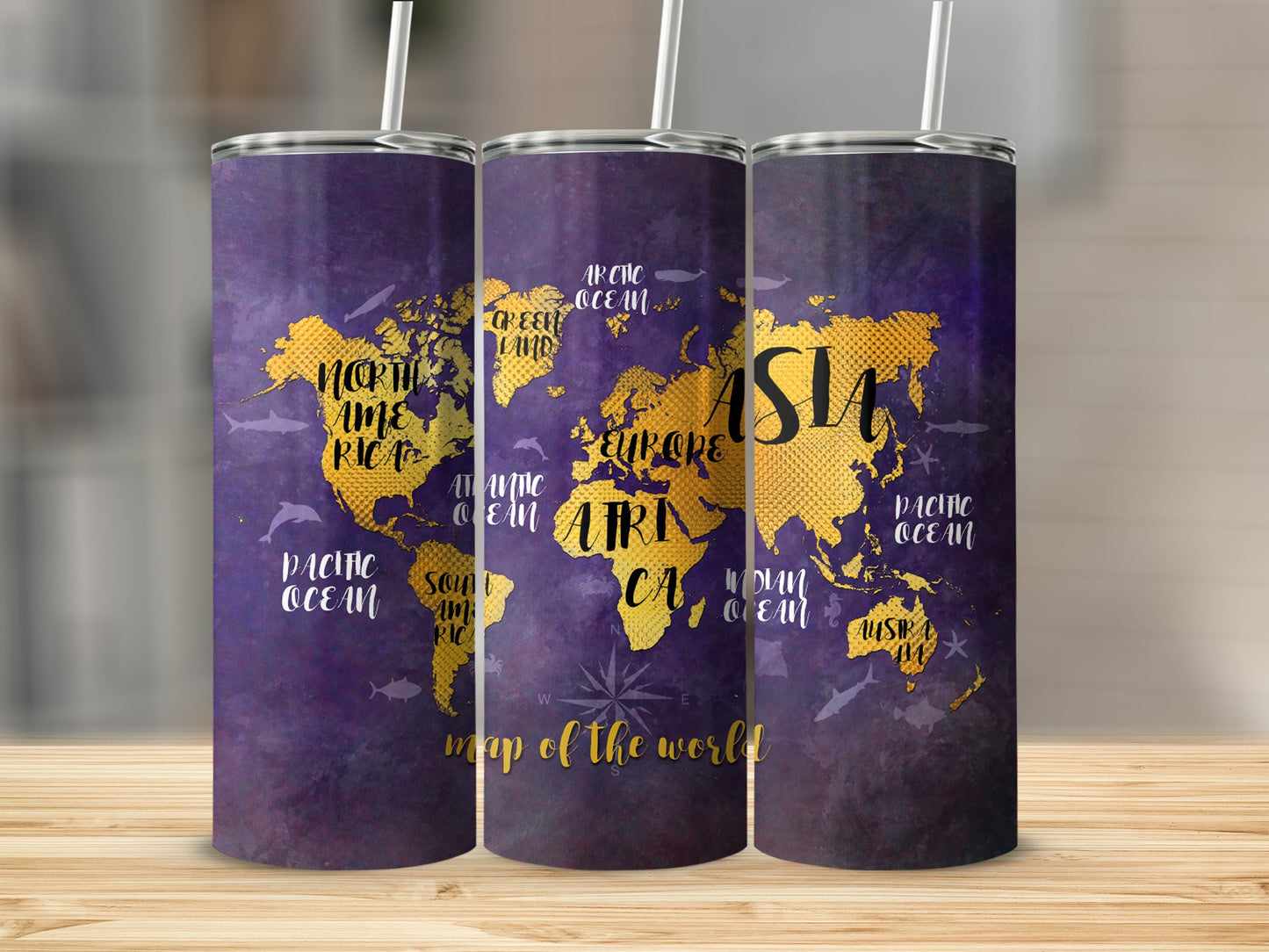Purple tumbler with a gold world map, ocean names, and sea creatures.