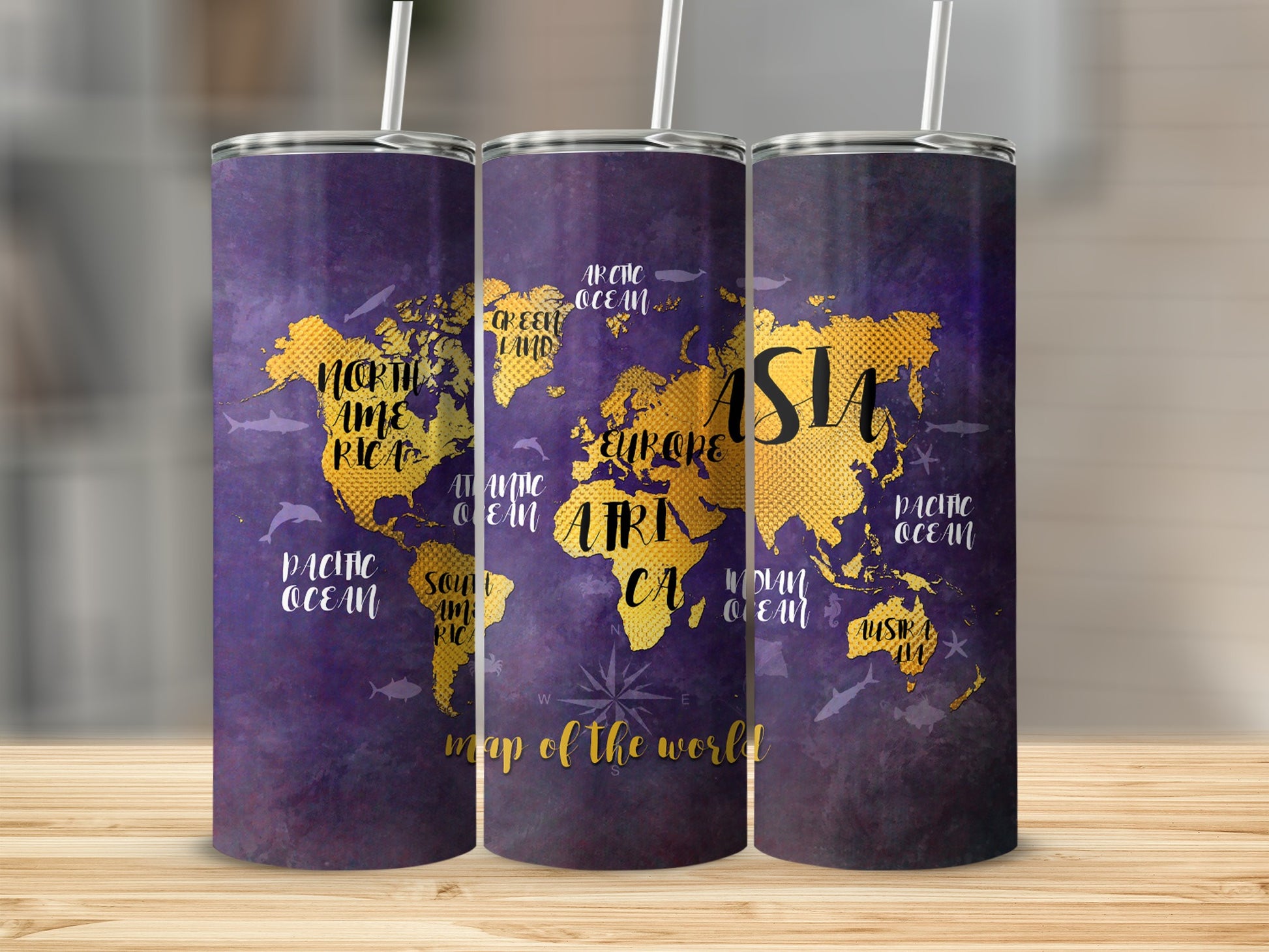Purple tumbler with a gold world map, ocean names, and sea creatures.