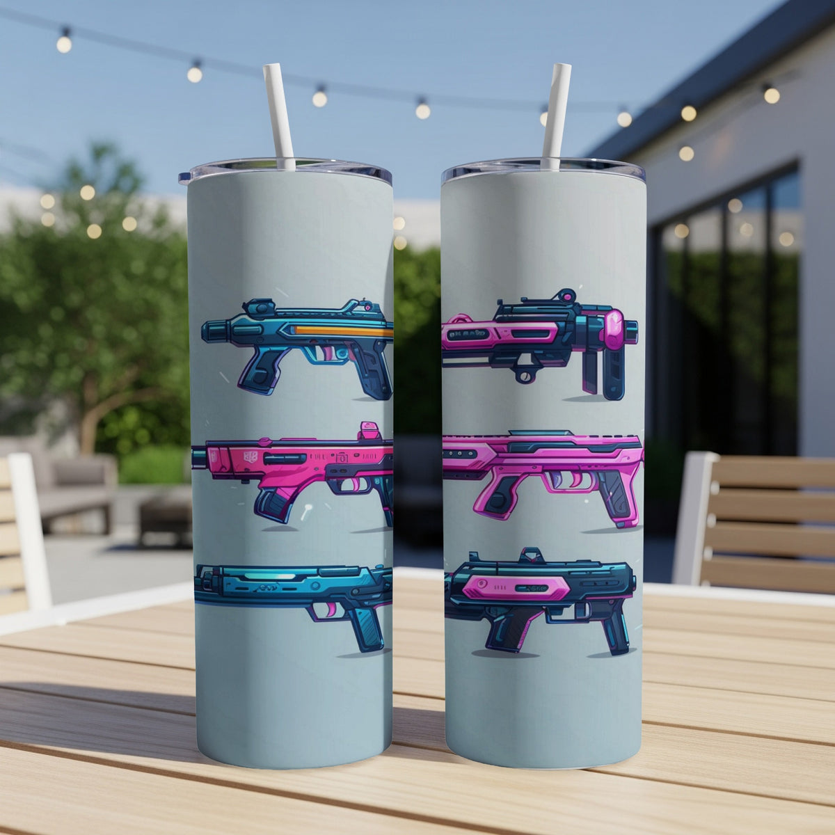 Two tumblers with stylized gun illustrations on a table outdoors.