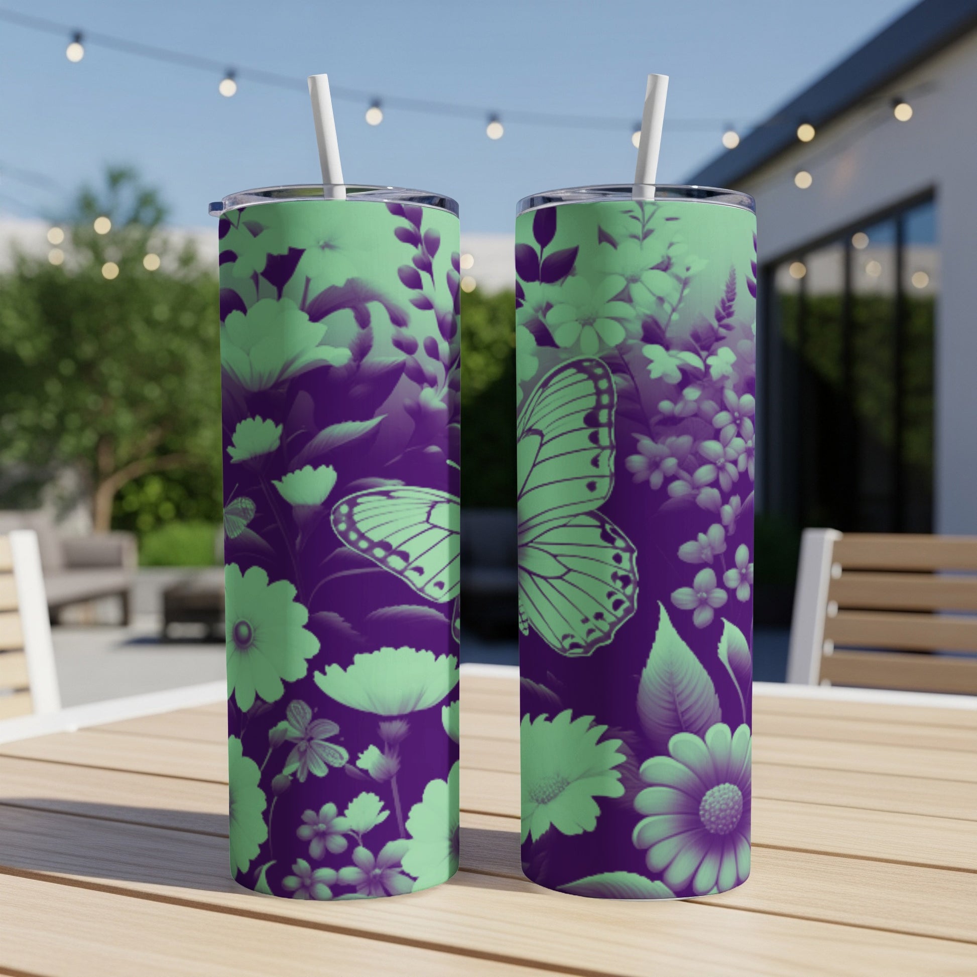 Purple and mint green floral pattern with a butterfly on two tumblers.