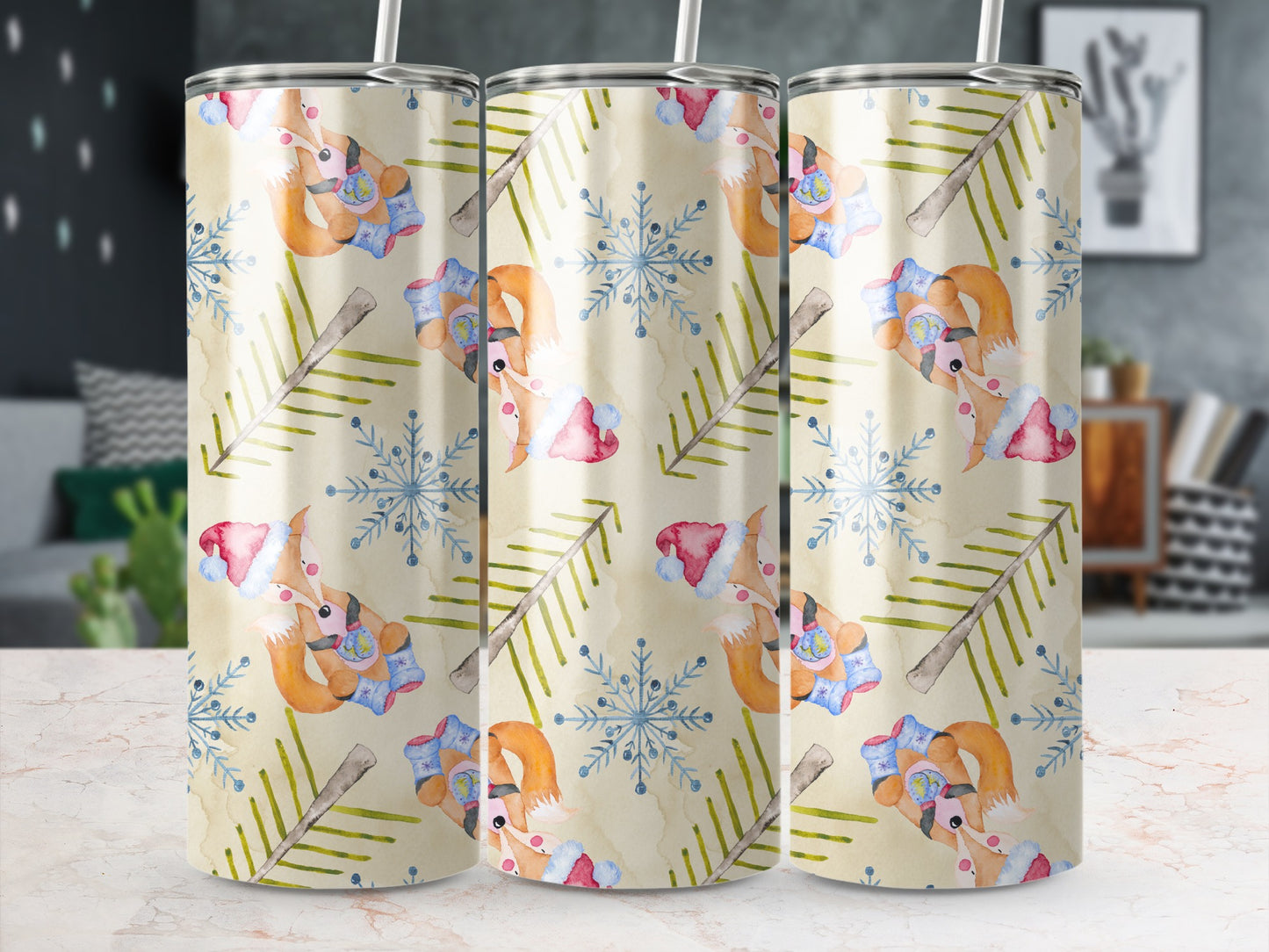 Three tumblers with a watercolor pattern of reindeer and snowflakes.