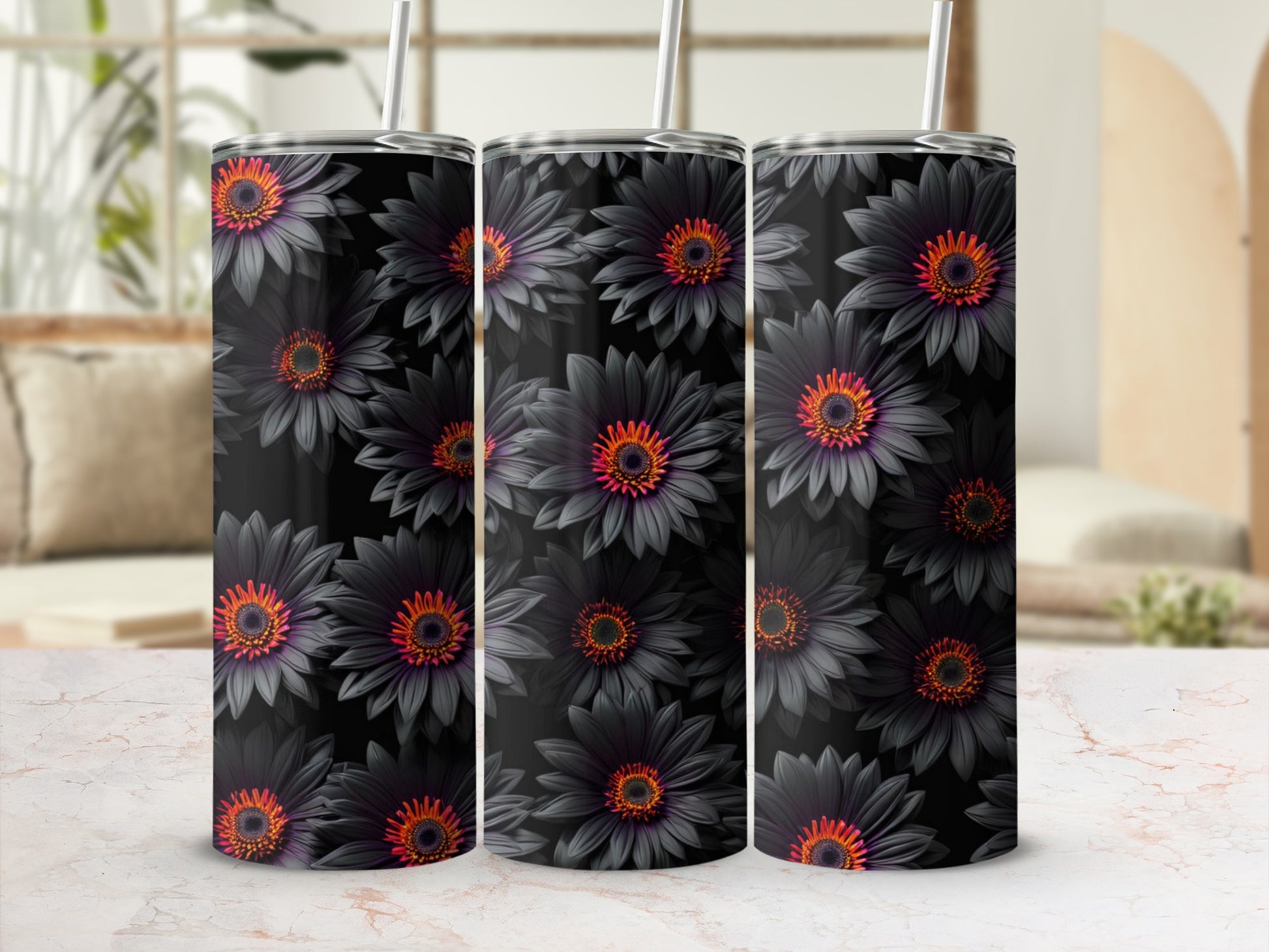Three dark floral tumblers with straws, detailed with orange and purple centers.