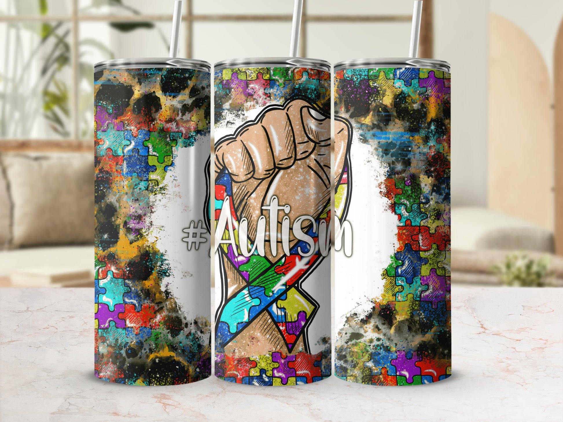 Tumbler with #Autism puzzle ribbon and abstract colorful background.